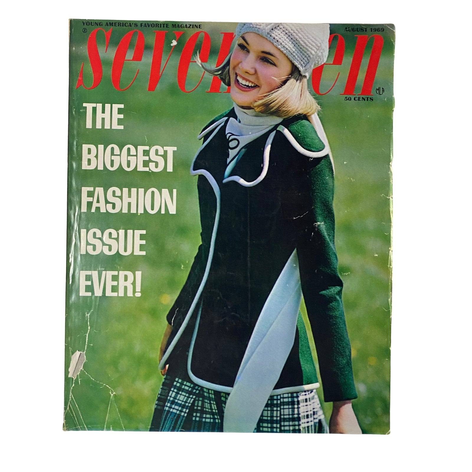 Seventeen Magazine August 1969 Fashion Issue featuring a young woman smiling and wearing a stylish green jacket over a plaid outfit, embodying the fashion trends of the late 1960s. This cover highlights the theme "The Biggest Fashion Issue Ever!".