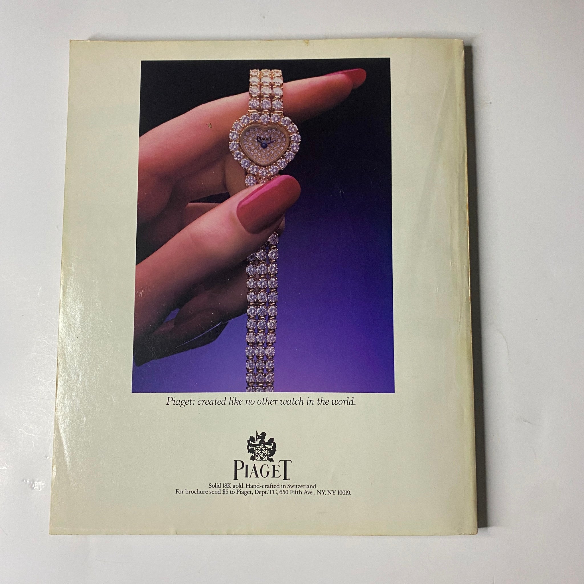 Back cover of Town & Country Magazine March 1986 featuring an advertisement for Piaget jewelry, showcasing a luxurious watch adorned with diamonds, accompanied by the tagline 'Piaget: created like no other watch in the world'.