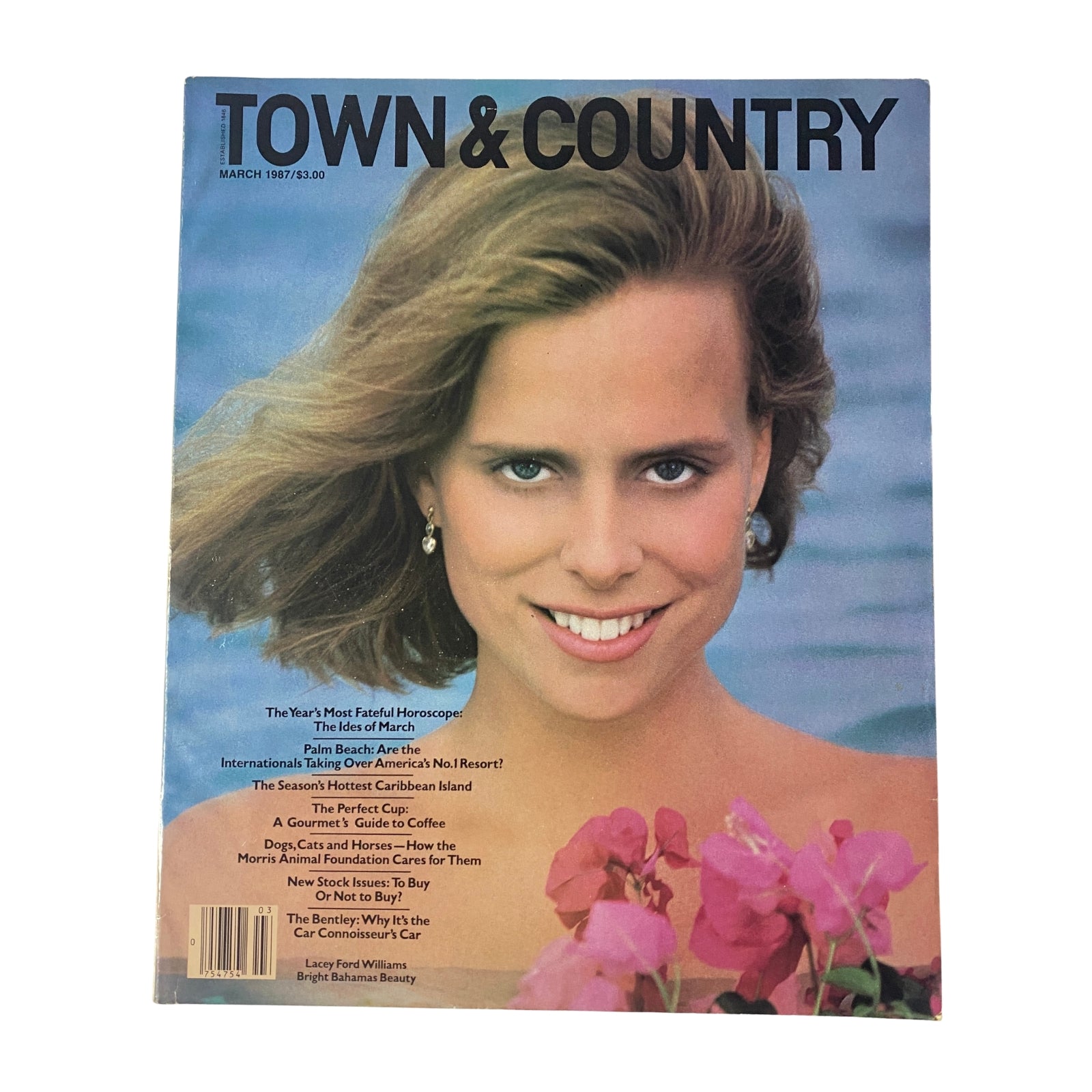 Cover of Town & Country Magazine March 1987 featuring Lacey Ford Williams smiling with vibrant flowers, showcasing high fashion and luxury lifestyle.