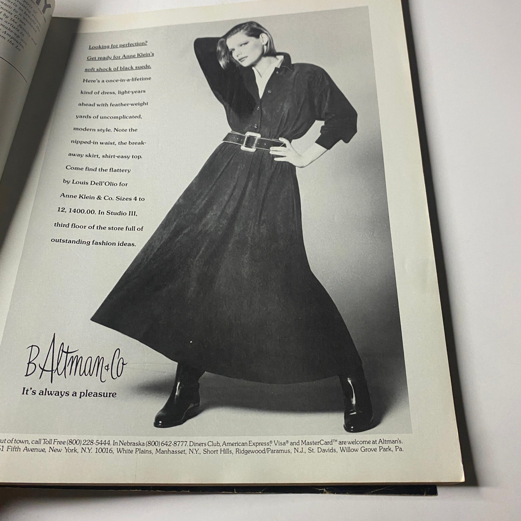 Fashion advertisement in Town & Country Magazine June 1985 showcasing a model in a stylish black dress.