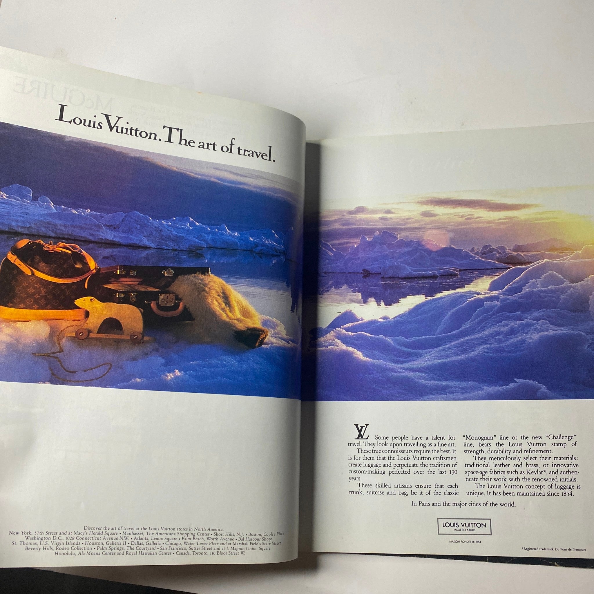 Luxury travel advertisement in Town & Country Magazine June 1985 featuring Louis Vuitton products over scenic icy landscape.