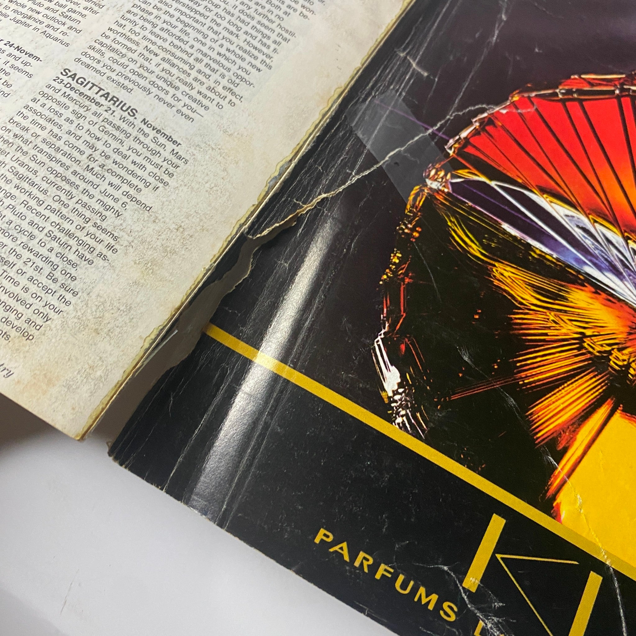Damaged section of Town & Country Magazine June 1985, highlighting signs of aging with wear on a vibrant advertisement.