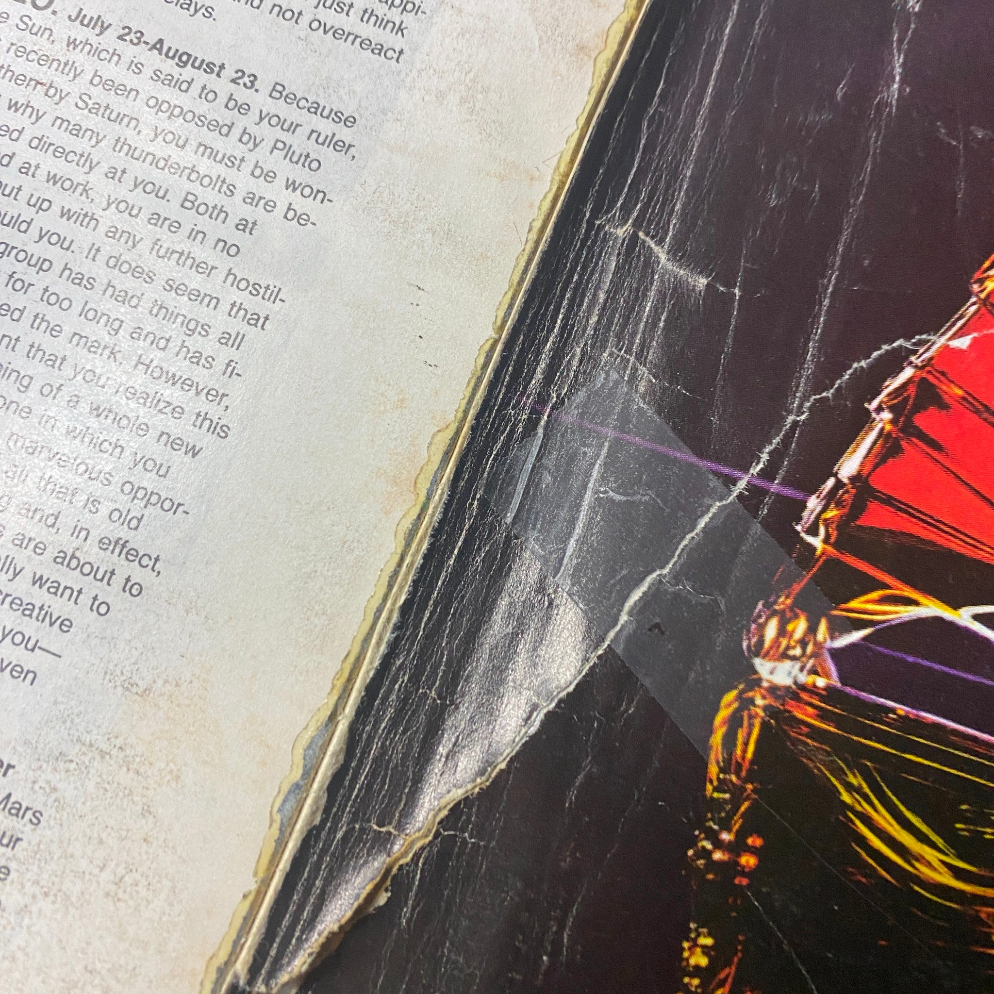 Close-up of damage to the side of Town & Country Magazine June 1985, showing significant wear on the page.