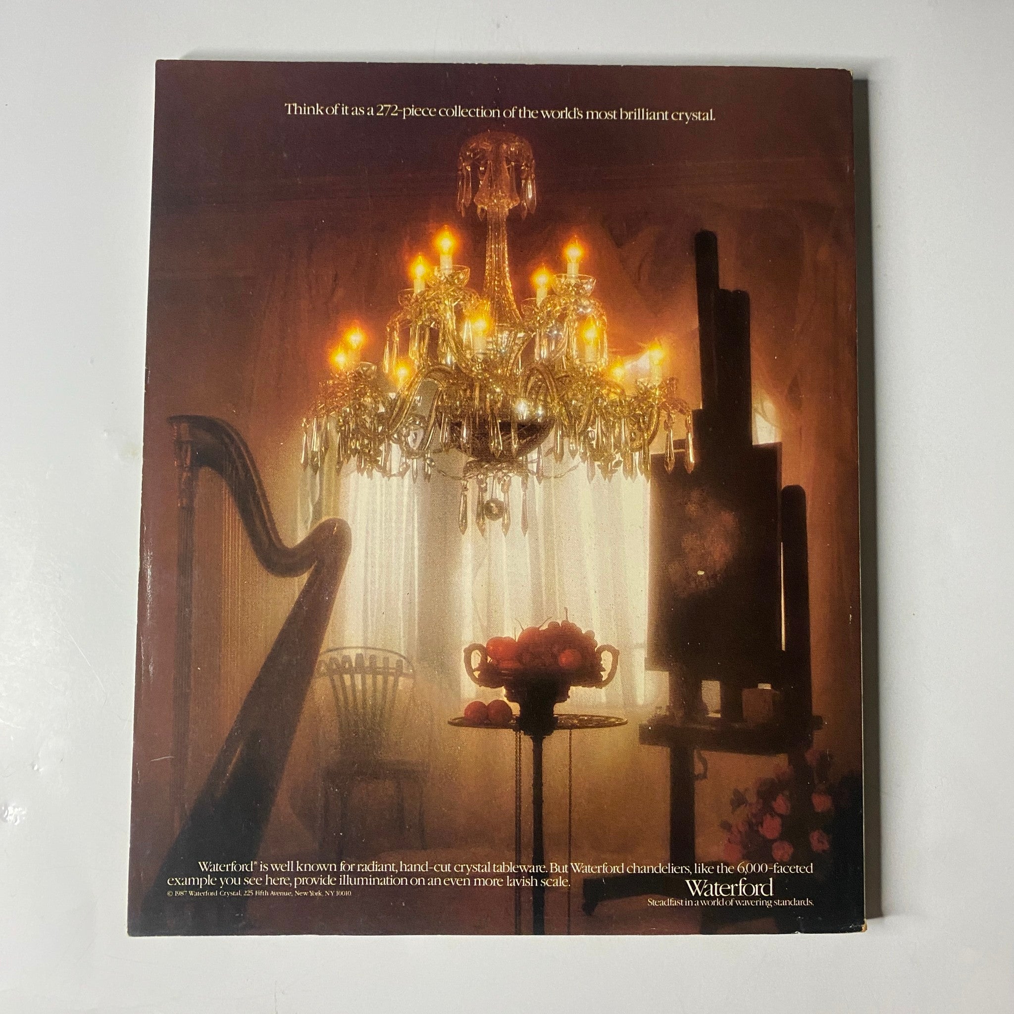 Back cover of Town & Country Magazine August 1987, featuring a Waterford crystal advertisement with a chandelier and floral arrangement, showcasing luxury brand products.