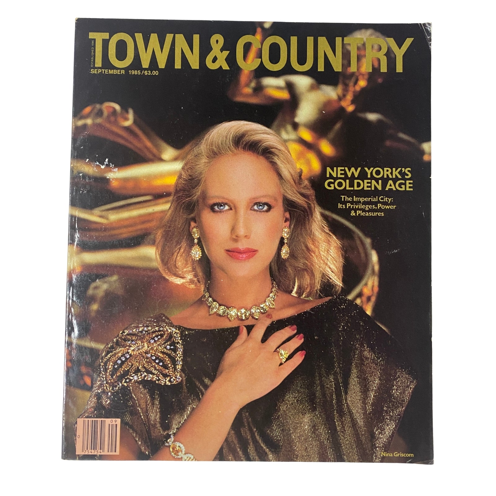 Cover image of Town & Country Magazine September 1985 featuring Nina Griscom in an elegant pose, adorned with extravagant jewelry, showcasing mid-80s glamour.