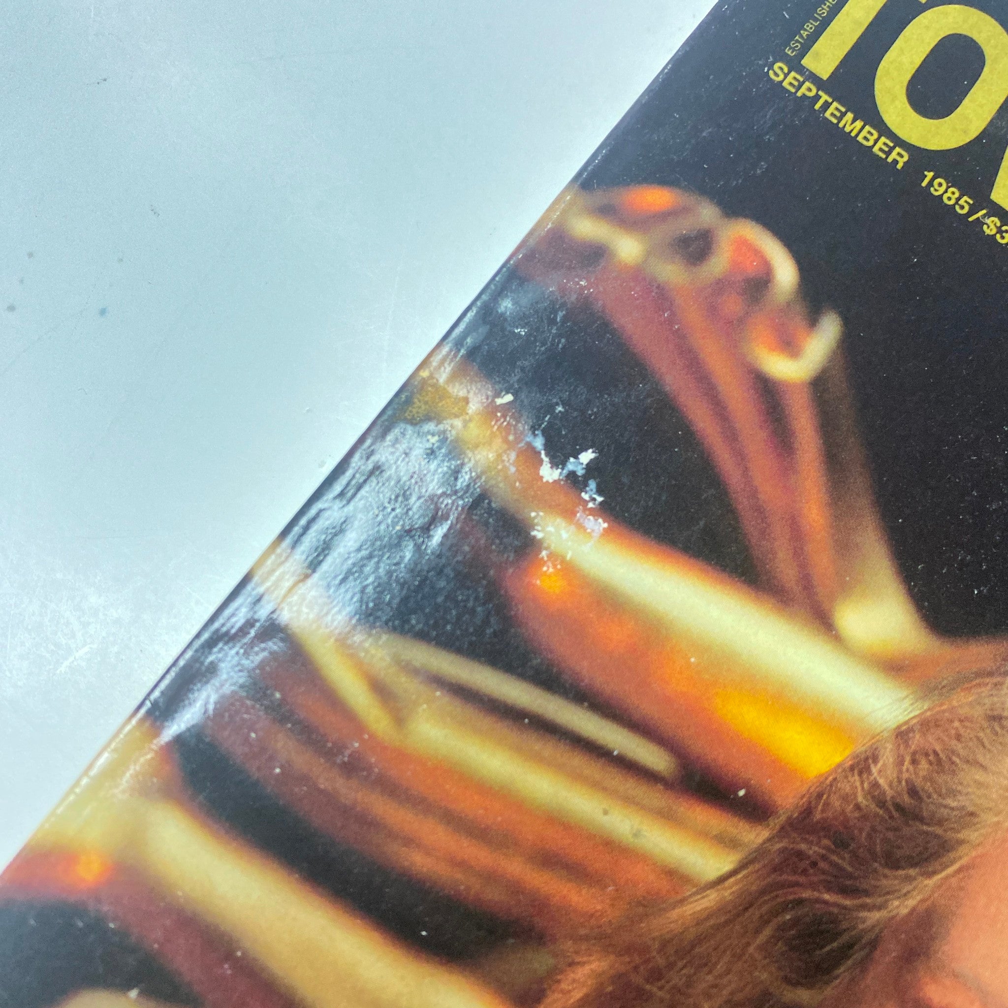 Close-up detail of the cover of Town & Country Magazine September 1985, highlighting minor imperfections, showing signs of age with the title prominently displayed.