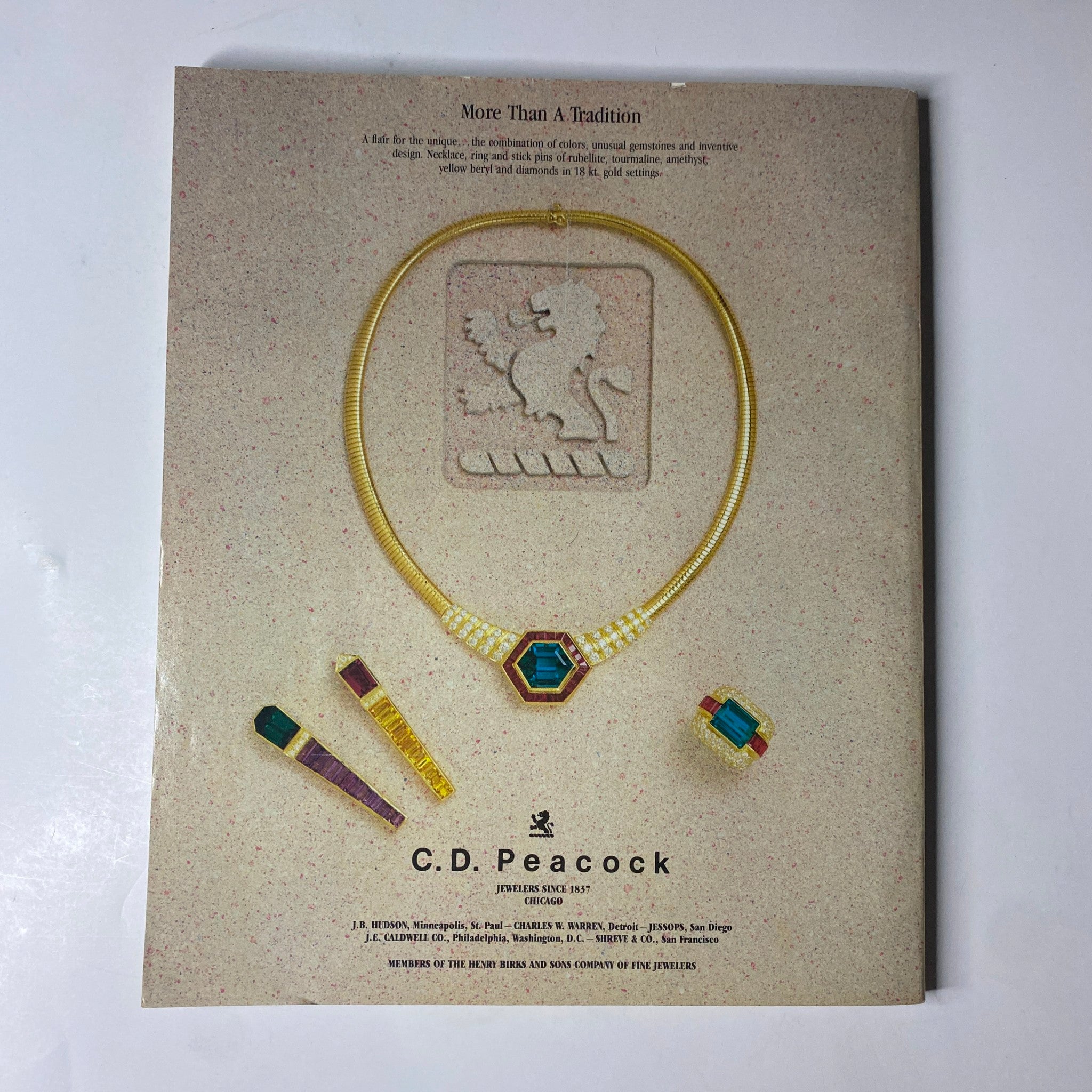 Ad for C.D. Peacock jewelry, featuring a stunning necklace and accessories, highlighted in Town & Country Magazine May 1987, emphasizing luxury and elegance.