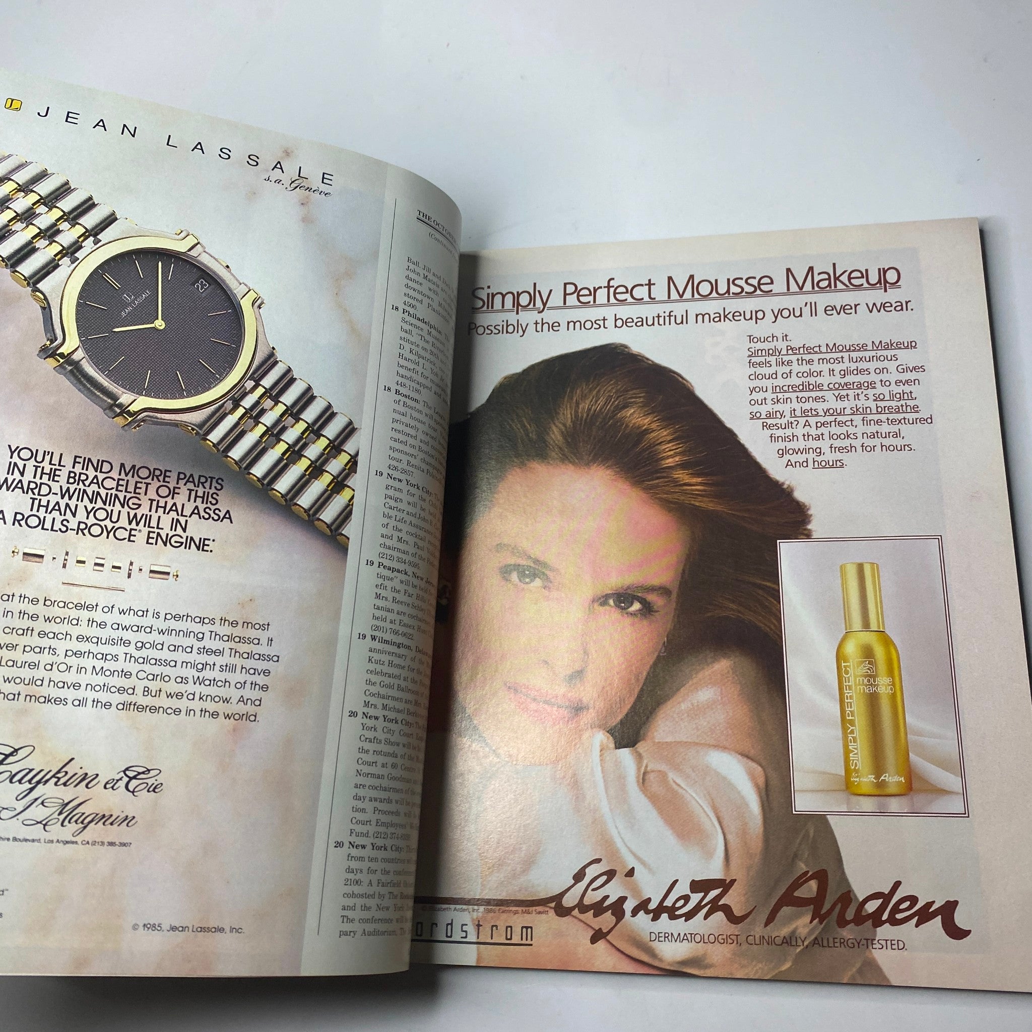 An advertisement page from Town & Country Magazine October 1986 for Elizabeth Arden makeup, showcasing beauty products alongside a model, representing timeless style.