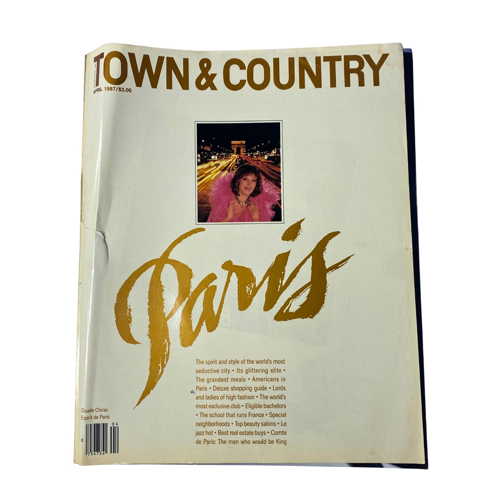 Town & Country Magazine April 1987 featuring Claude Chirac on the cover, showcasing Parisian glamour with the Eiffel Tower and Champs-Élysées backdrop.