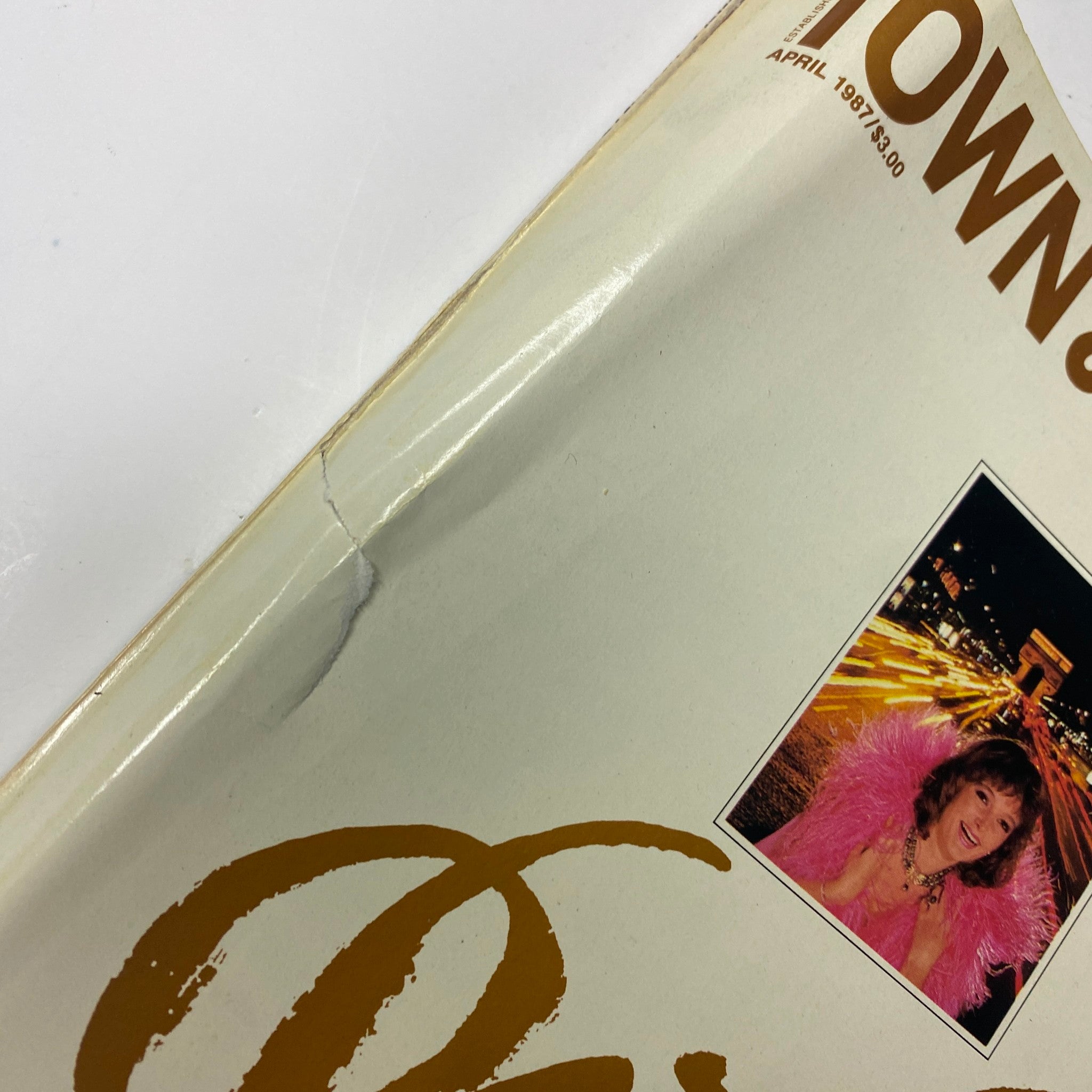 Cover detail of Town & Country Magazine April 1987 featuring Claude Chirac, showcasing a stylish pink ensemble against a vibrant night backdrop.