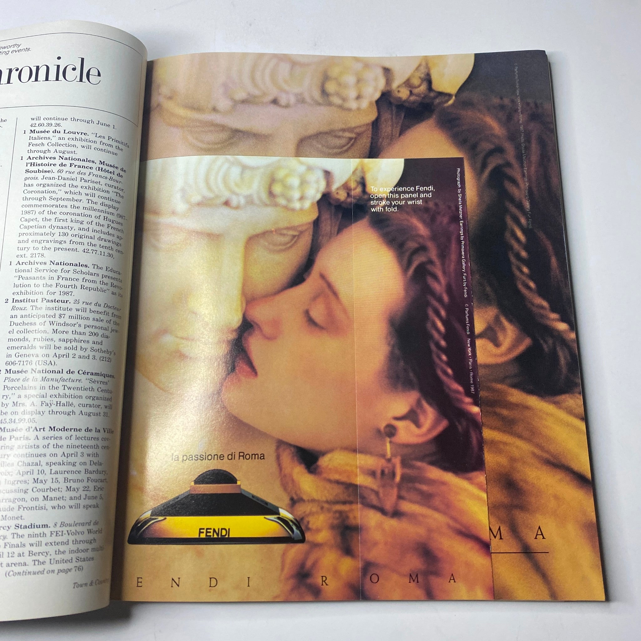 Fashion advertisement in Town & Country Magazine April 1987 featuring a themed campaign by Fendi, showcasing a romantic scene with classical sculpture.