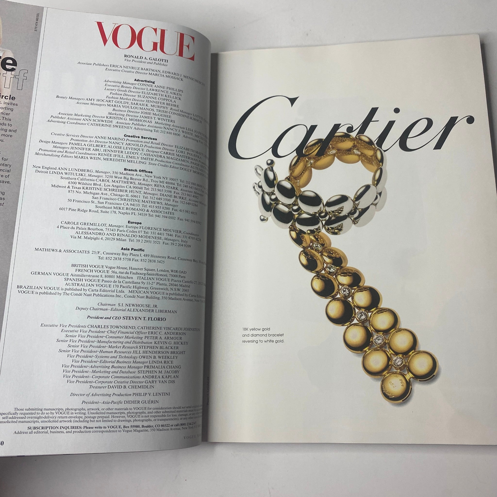 A striking advertisement in Vogue Magazine May 1998 for Cartier jewelry, displaying an elegant gold bracelet in a luxury setting.