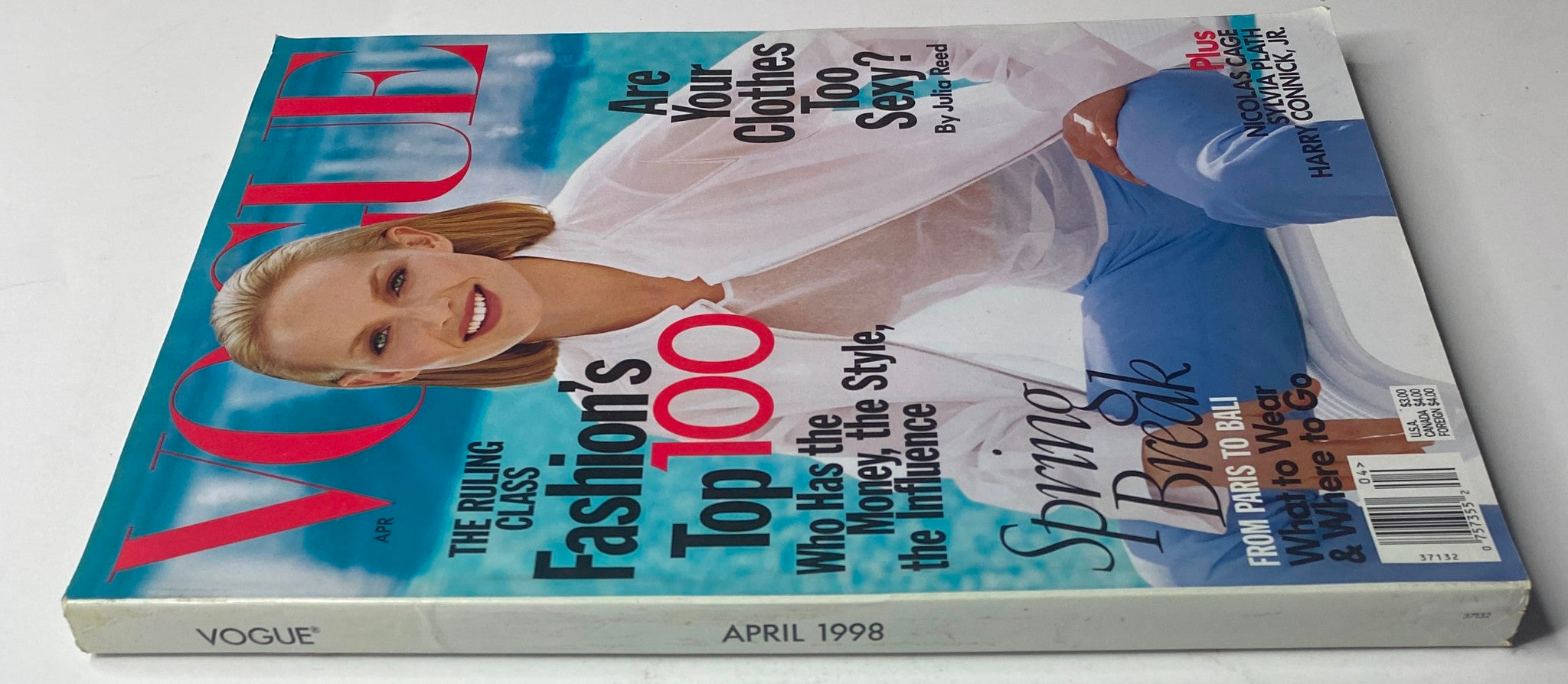 Close-up view of the Vogue Magazine April 1998 with Amber Valletta's cover image, showcasing fashion insights and topics like 'Fashion's Top 100' and 'Spring Break'.