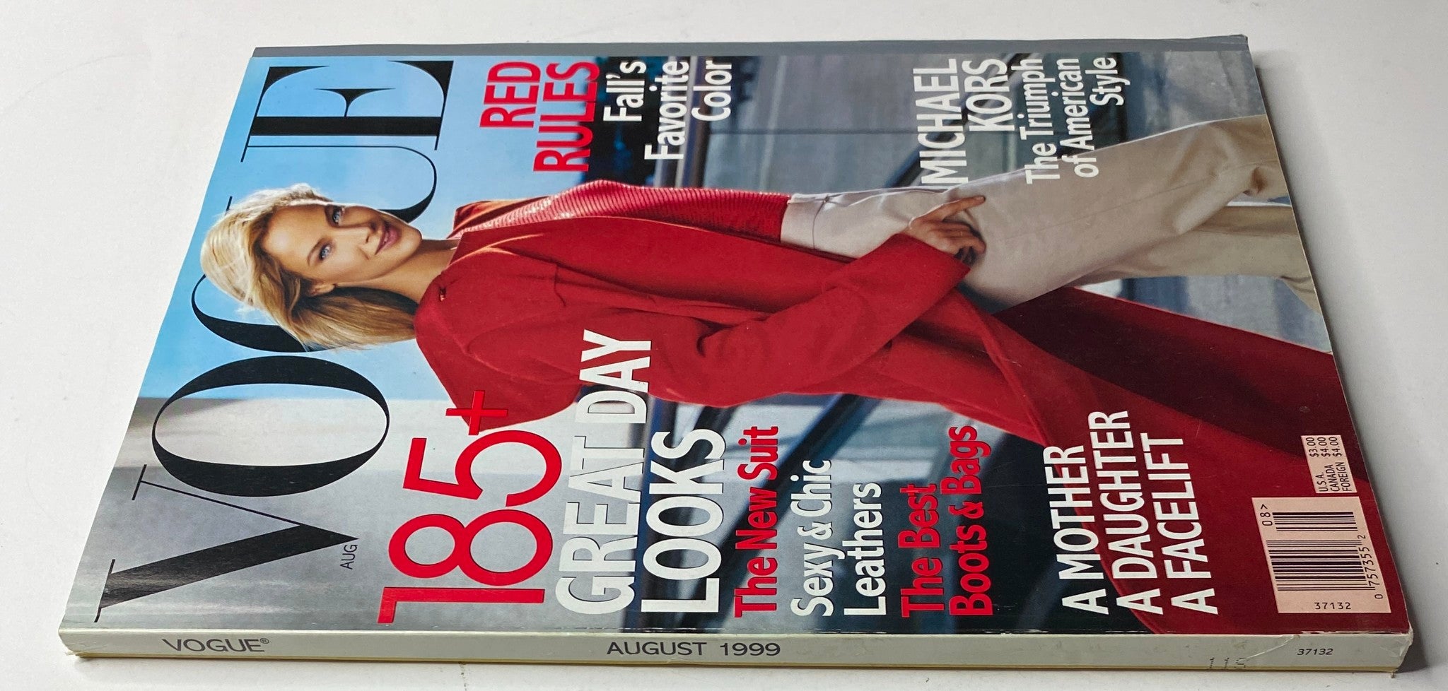 Close-up of Vogue Magazine August 1999 cover with Carolyn Murphy, highlighting the theme 'Red Rules' and articles on fashion and lifestyle. Vintage fashion collectible.