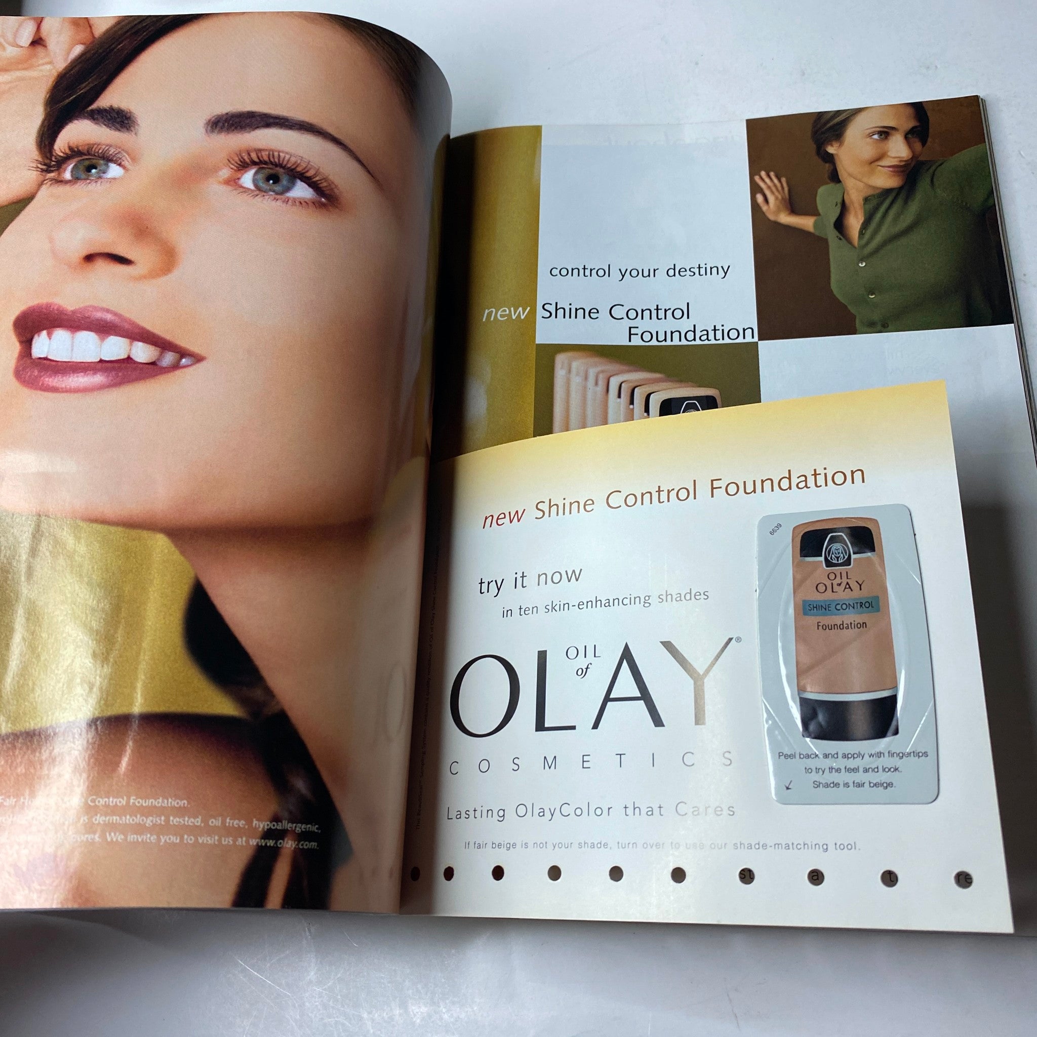 Vogue Magazine August 1999, highlighting an advertisement for Olay Cosmetics with a focus on 'Shine Control Foundation'.