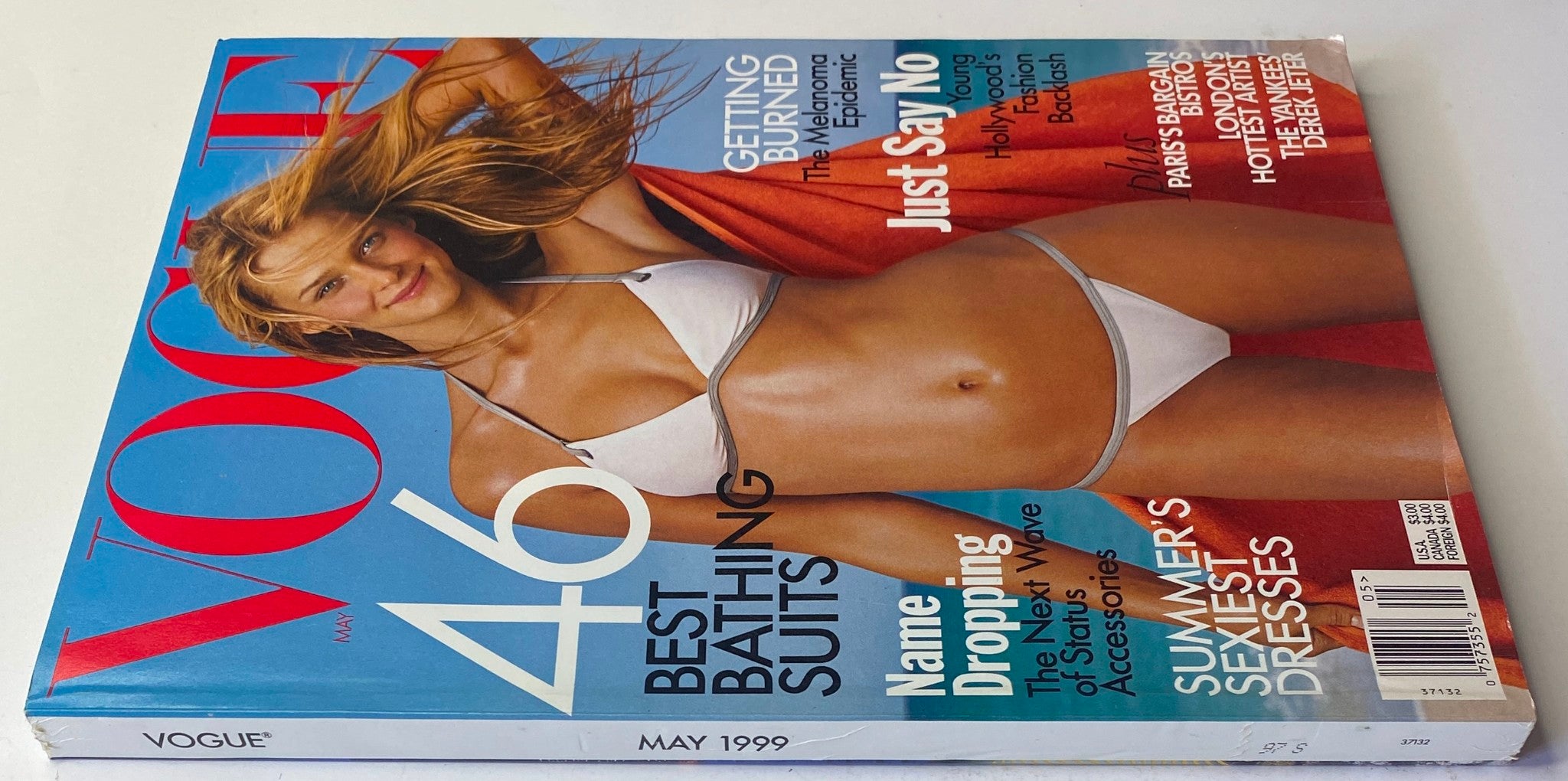 Vogue Magazine May 1999 cover featuring supermodel Carmen Kass in a bikini, highlighting summer fashion trends. This issue is labeled as No Label, Very Good Condition.