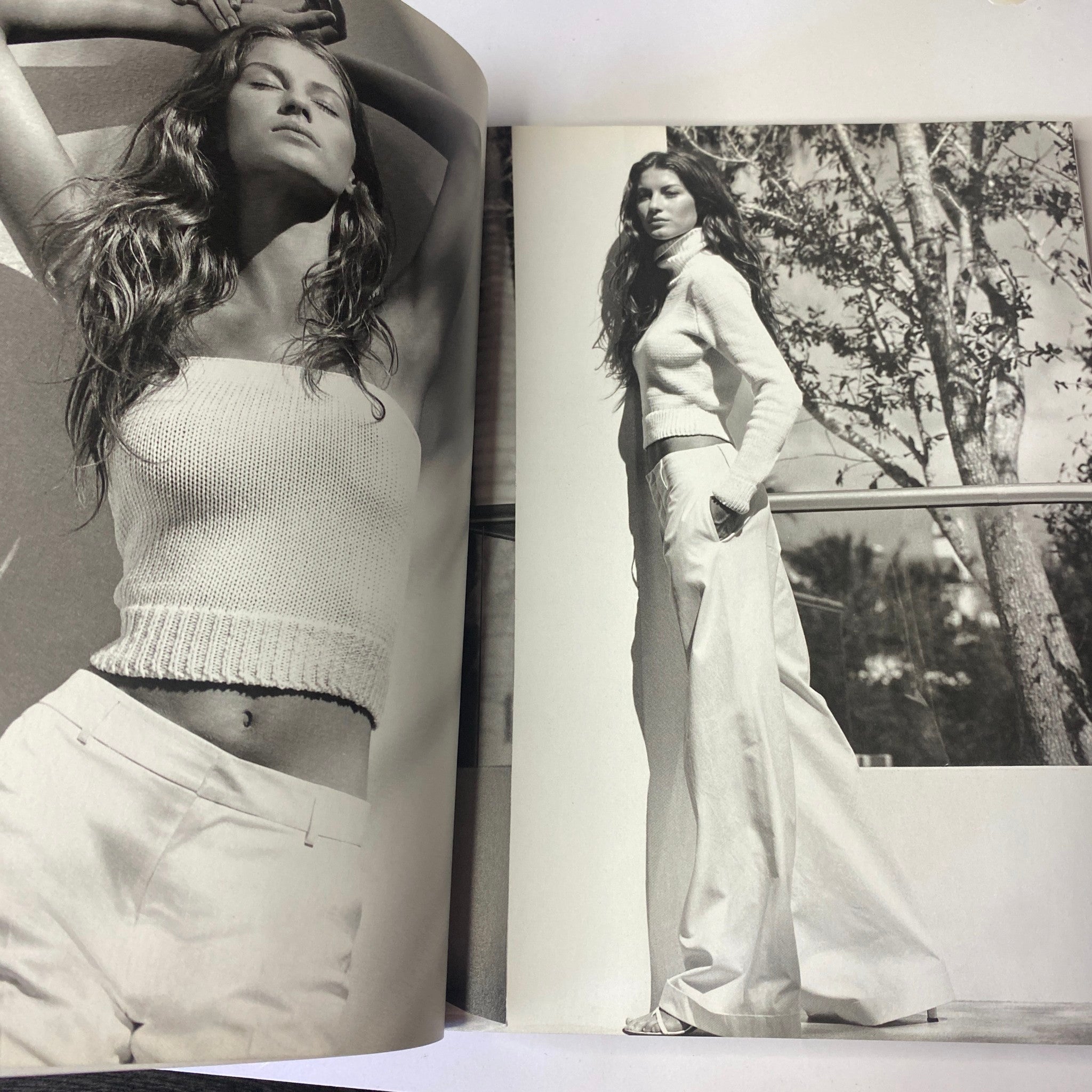 Fashion editorial from Vogue Magazine April 1999 featuring a model in a cropped knit top and wide-leg pants against a backdrop of greenery, highlighting spring fashion trends.