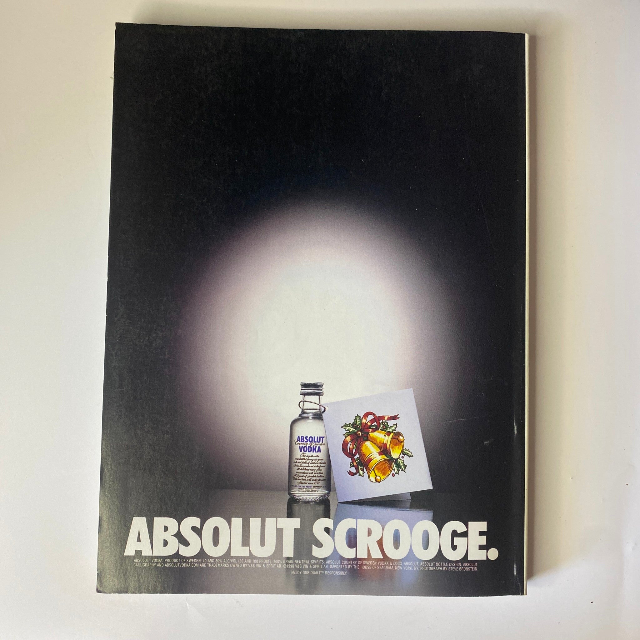 Vogue Magazine December 1998 advertisement for Absolut Vodka featuring a minimalist artistic design, promoting the signature drink with a seasonal twist.