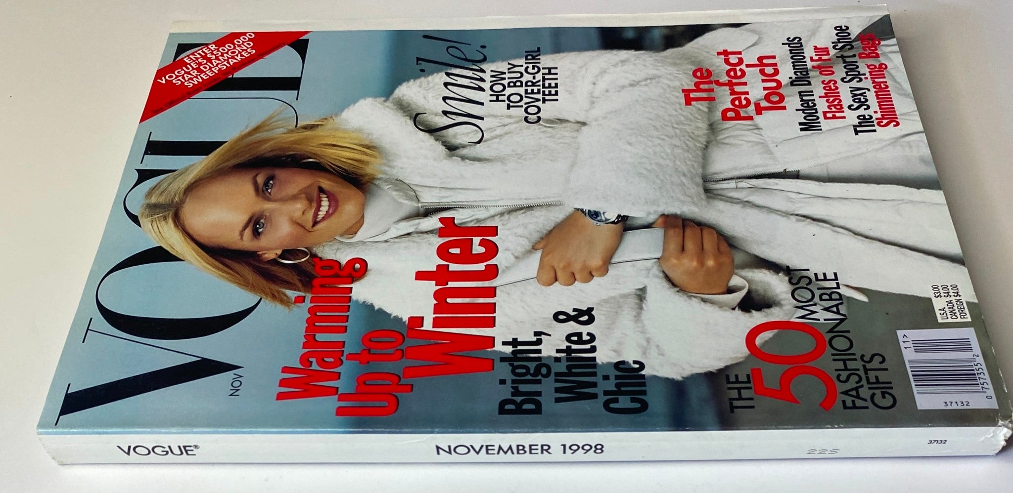 Another angle of Vogue Magazine November 1998 Amber Valletta Cover presenting a stylish winter fashion theme.