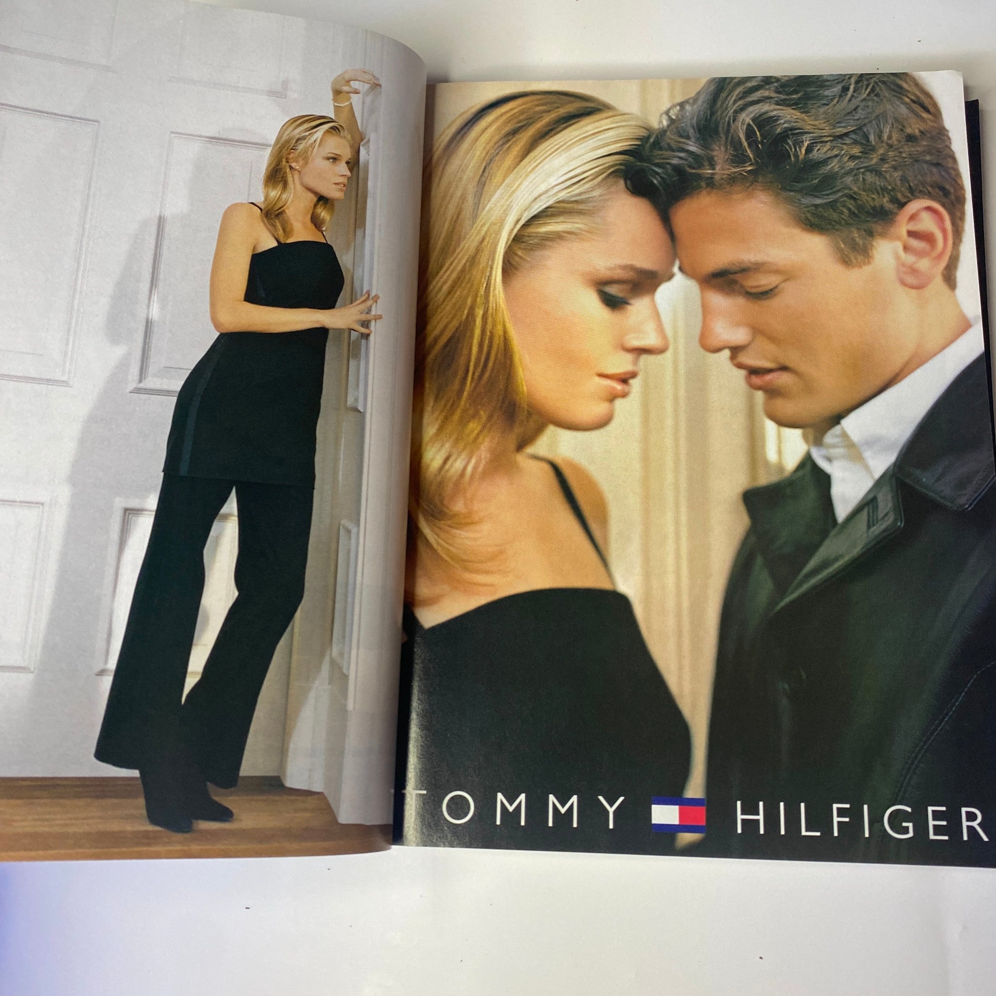 Fashion advertisement featuring models showcasing Tommy Hilfiger clothes, as seen in Vogue Magazine November 1998.