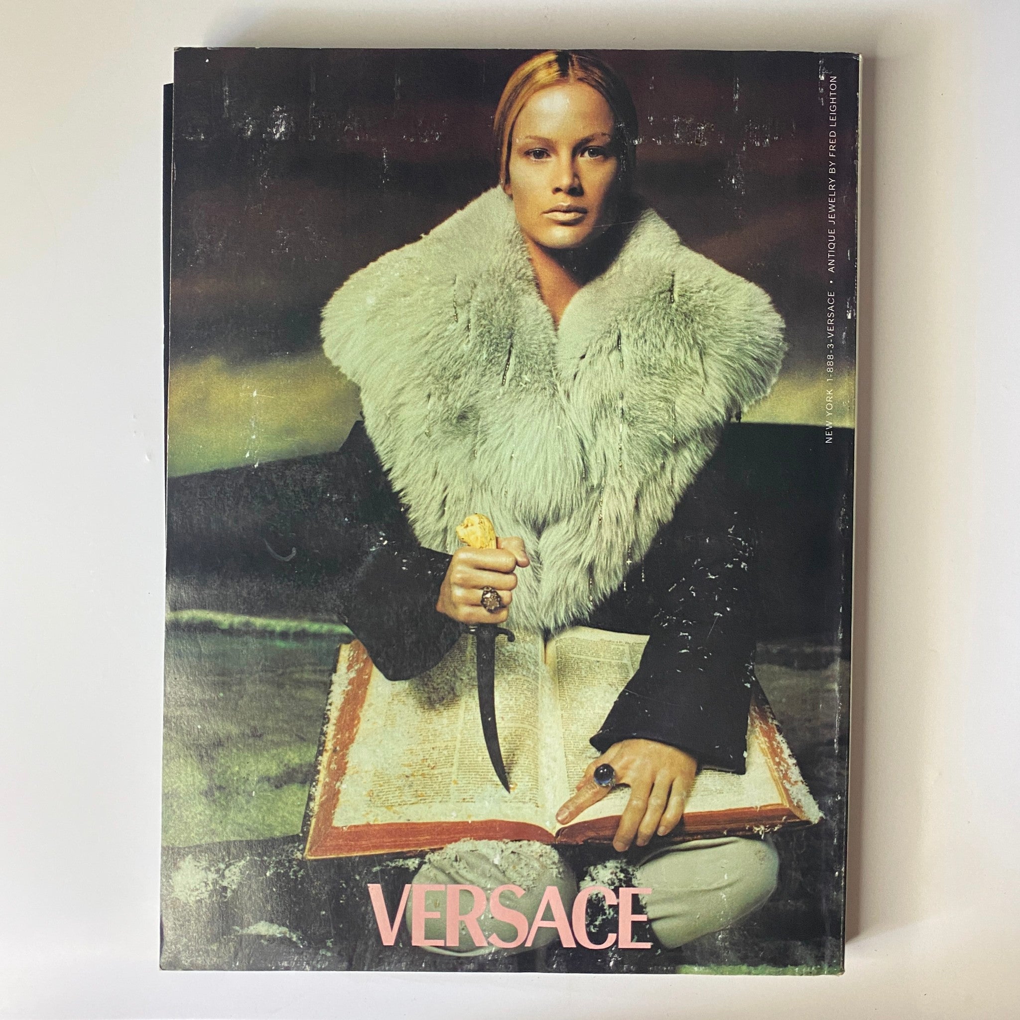 Cover of Vogue Magazine November 1998 featuring a striking model in a fur coat by Versace, highlighting luxury fashion and editorial style relevant to 1990s fashion history.
