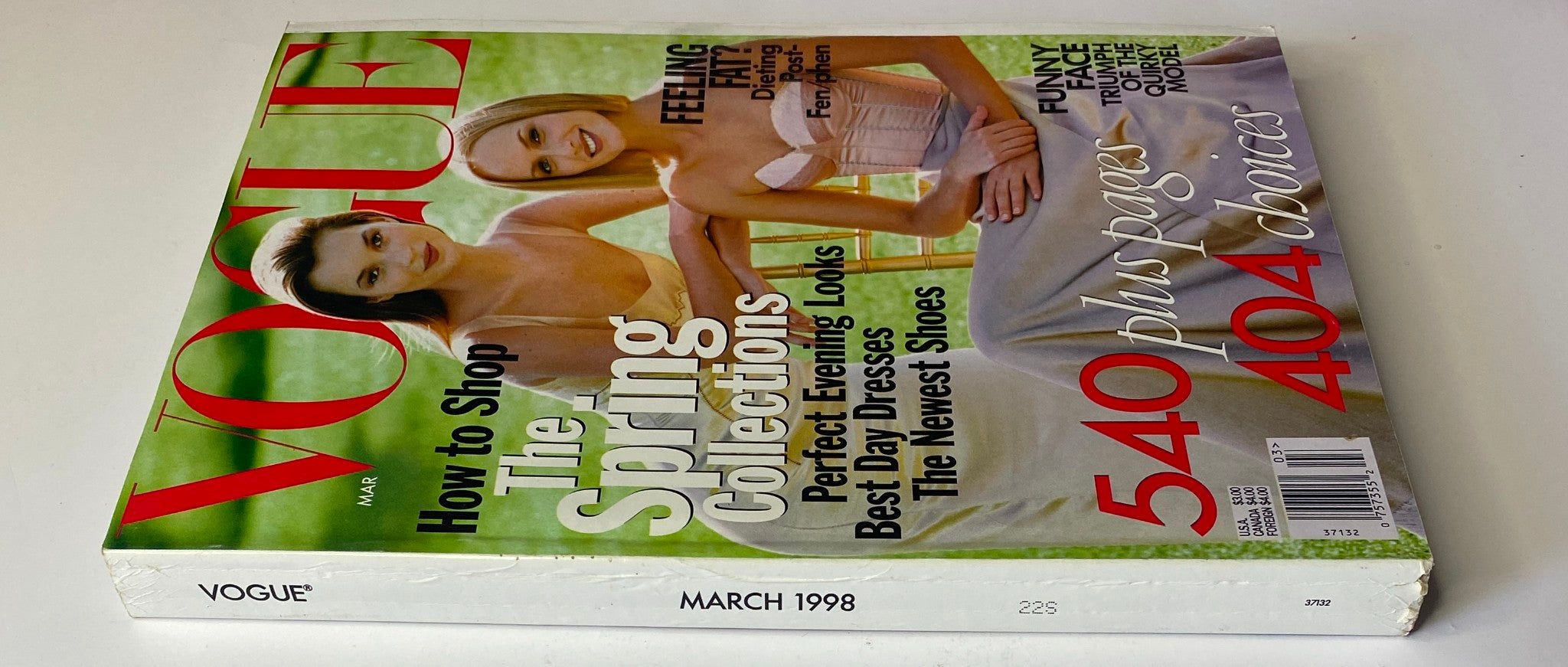 Vogue Magazine March 1998 featuring Kate Moss and Amber Valletta on the cover, showcasing fashion trends and spring collections.