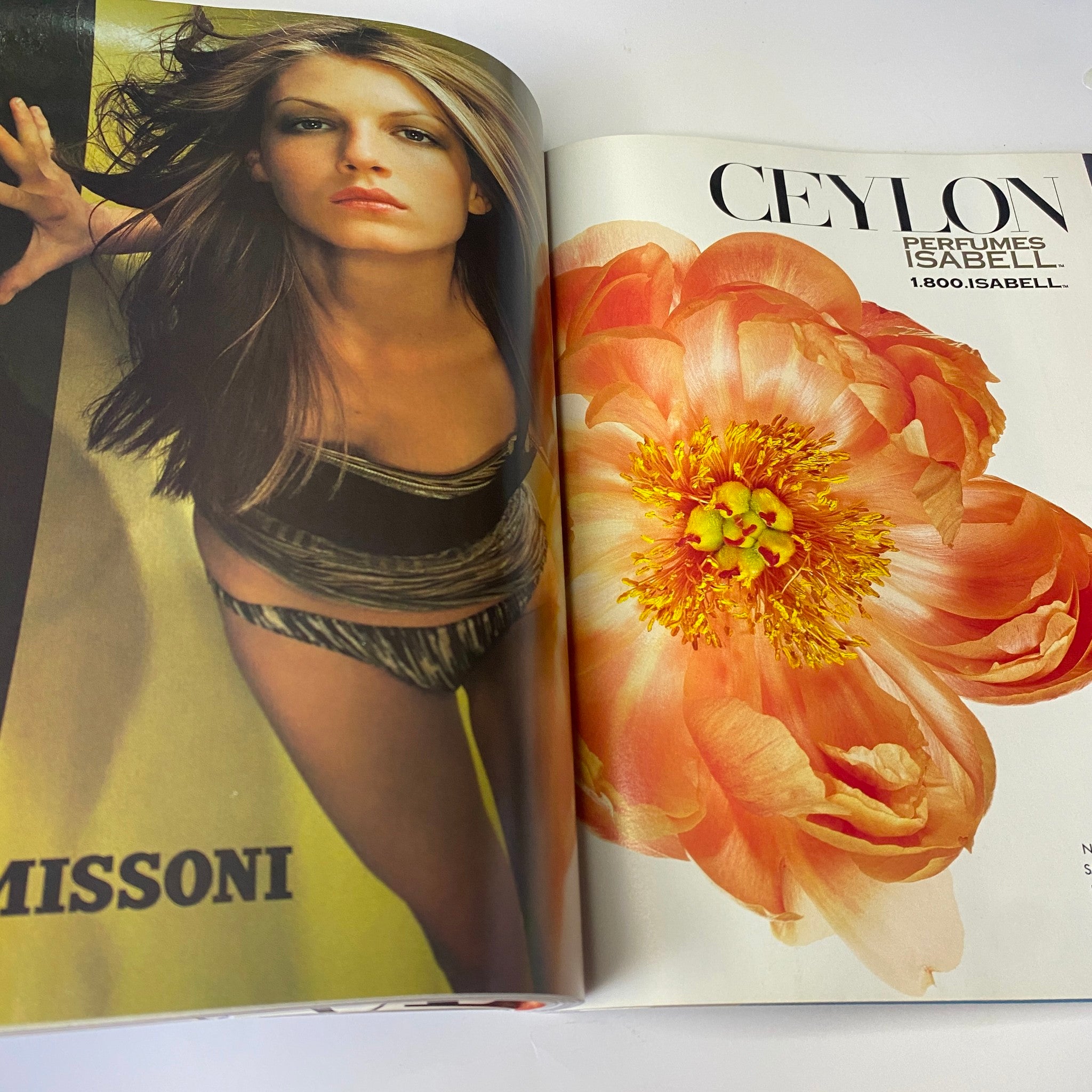 Fashion advertisement from Vogue Magazine March 1998 featuring a model in a stylish outfit for Missoni alongside a vibrant floral design.