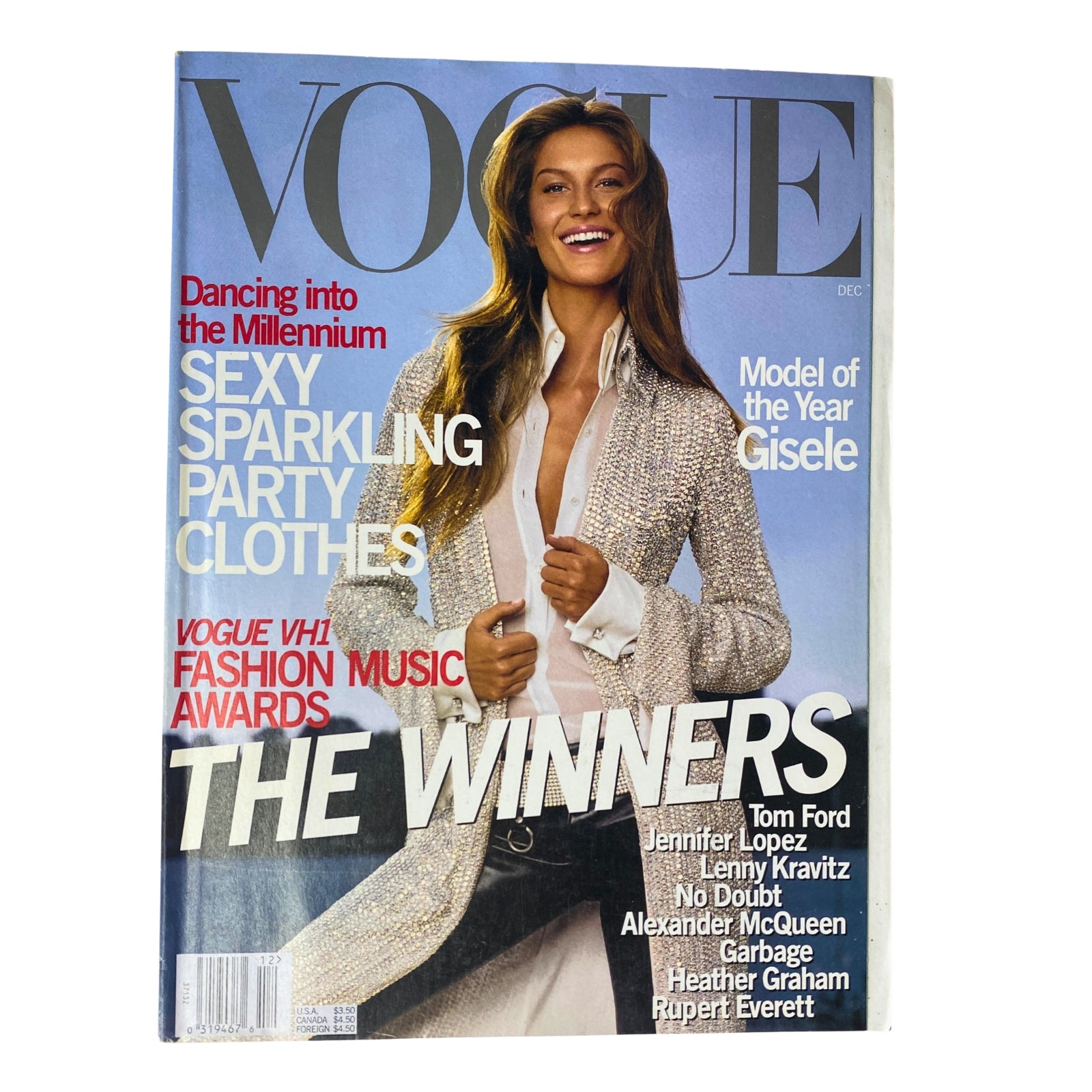 Vogue Magazine December 1999 cover featuring Gisele Bündchen, celebrating her title as Model of the Year. The cover displays vibrant text featuring 'Sexy Sparkling Party Clothes' and details on the Vogue/VH1 Fashion Music Awards.