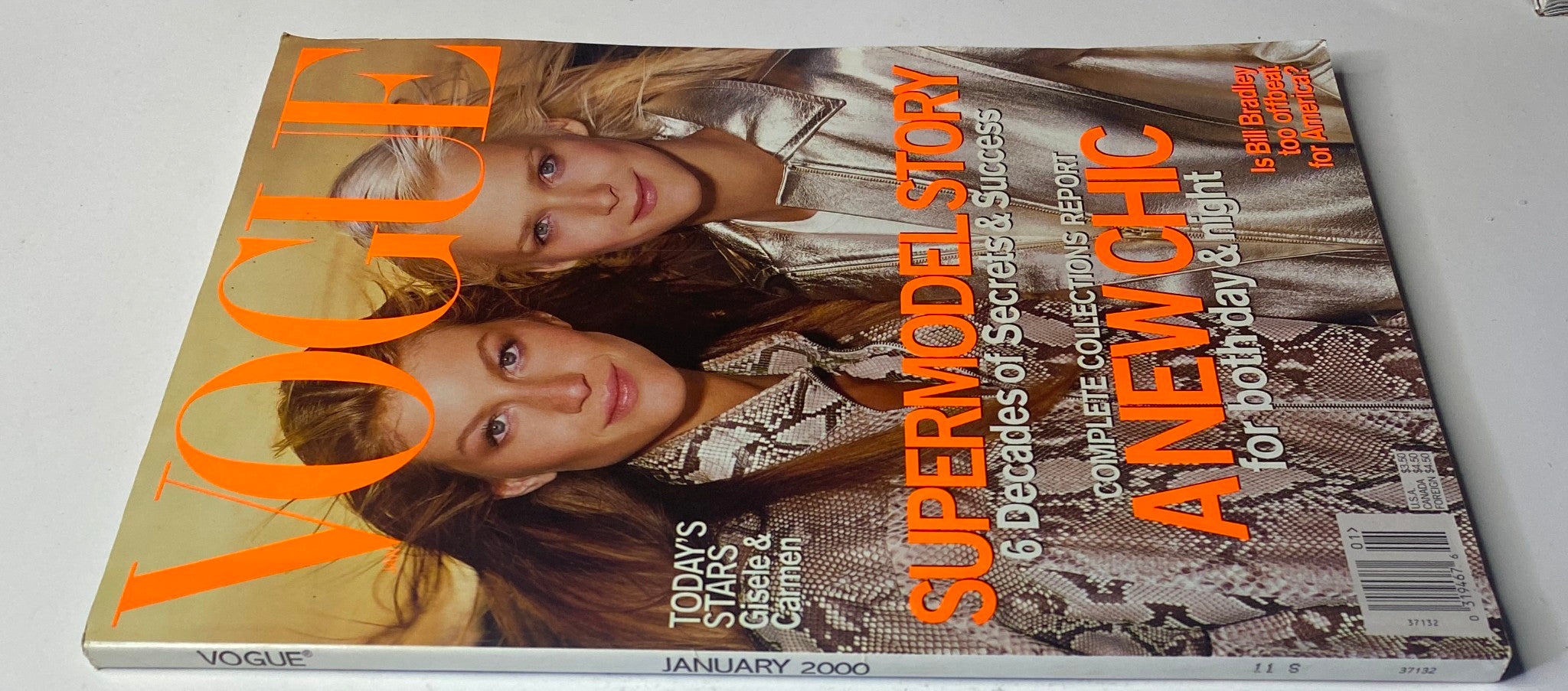 Vogue Magazine January 2000 cover featuring Gisele Bündchen and Carmen Kass styled in luxurious fashion, showcasing the supermodel era.
