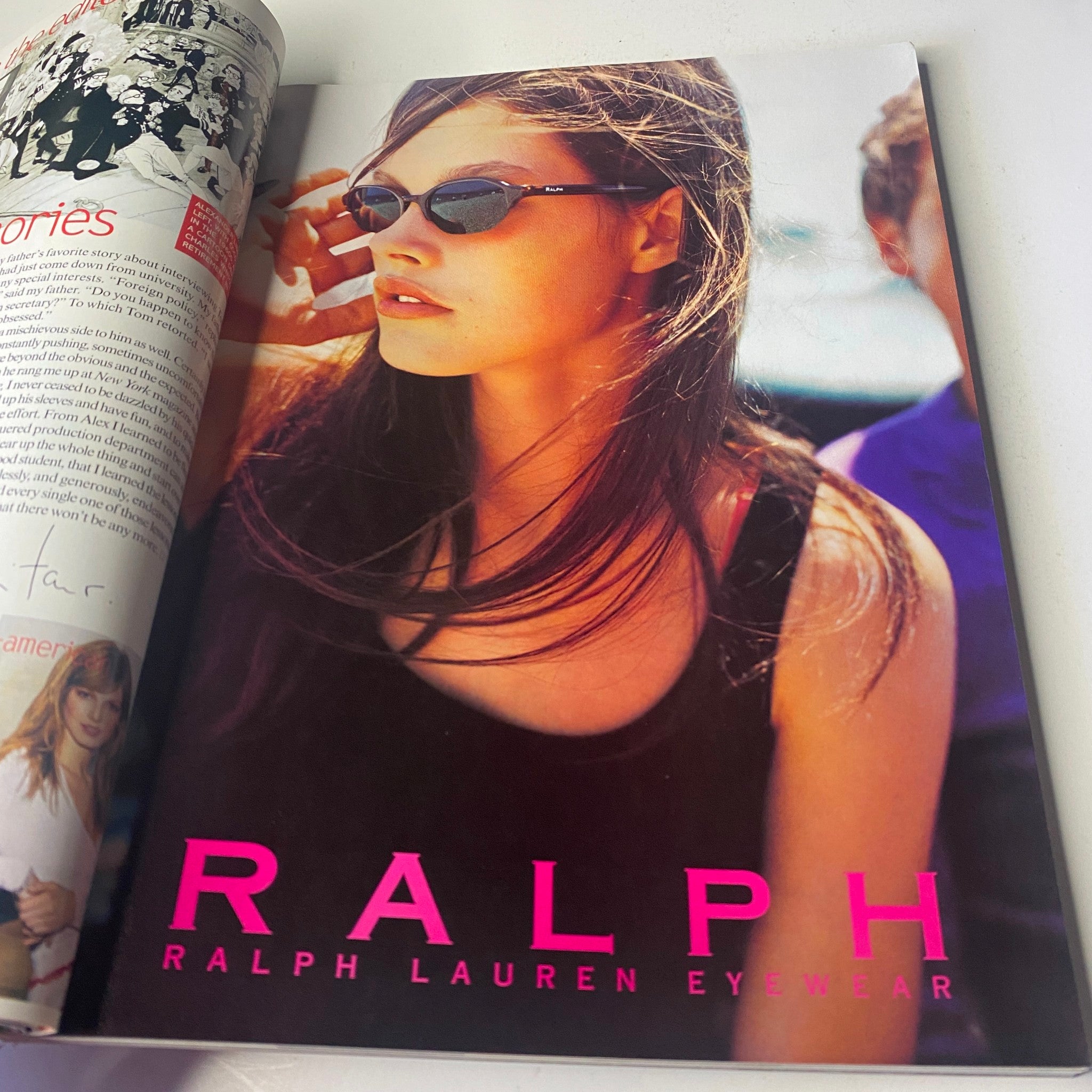 Vogue Magazine February 2000 Angela Lindvall Cover includes a Ralph Lauren Eyewear advertisement displaying a female model wearing sunglasses and a sleeveless outfit, exemplifying early 2000s chic style.
