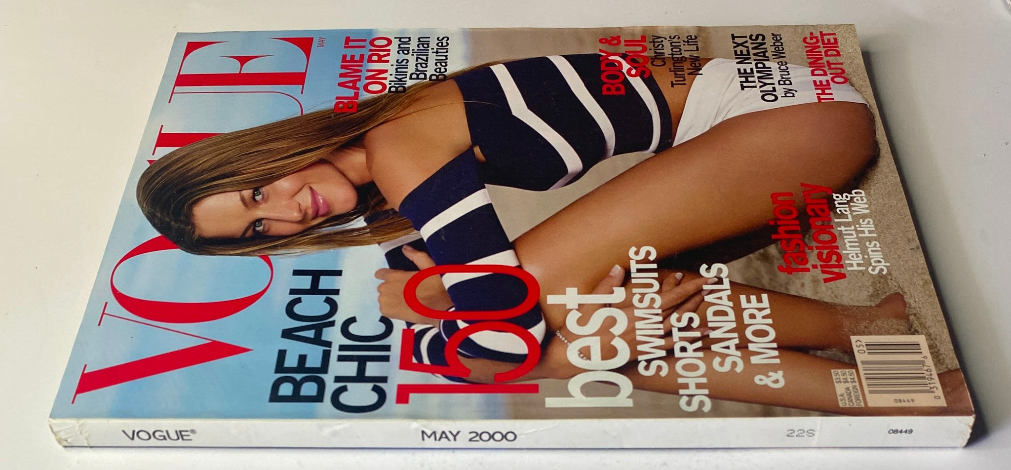 Side view of Vogue Magazine May 2000 showcasing Gisele Bündchen on the cover, emphasizing 'Beach Chic' and various featured articles including 'Blame It on Rio'.