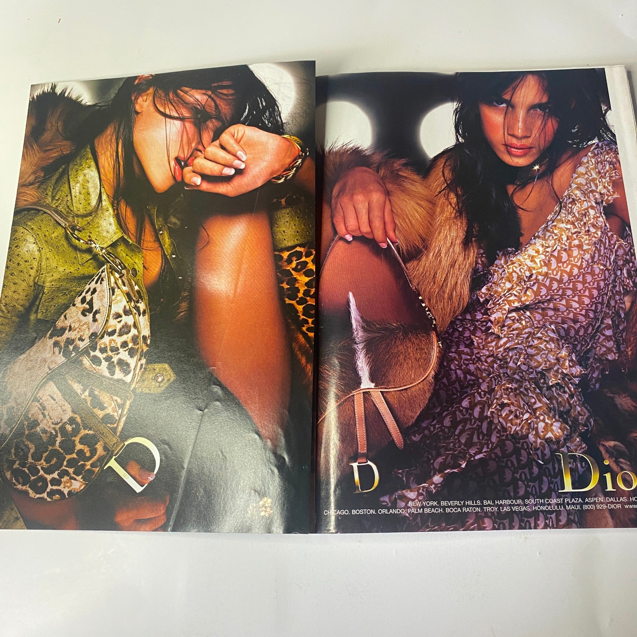 A fashion advertisement spread from Vogue Magazine July 2000 demonstrating bold styling with a focus on Dior fashion pieces.