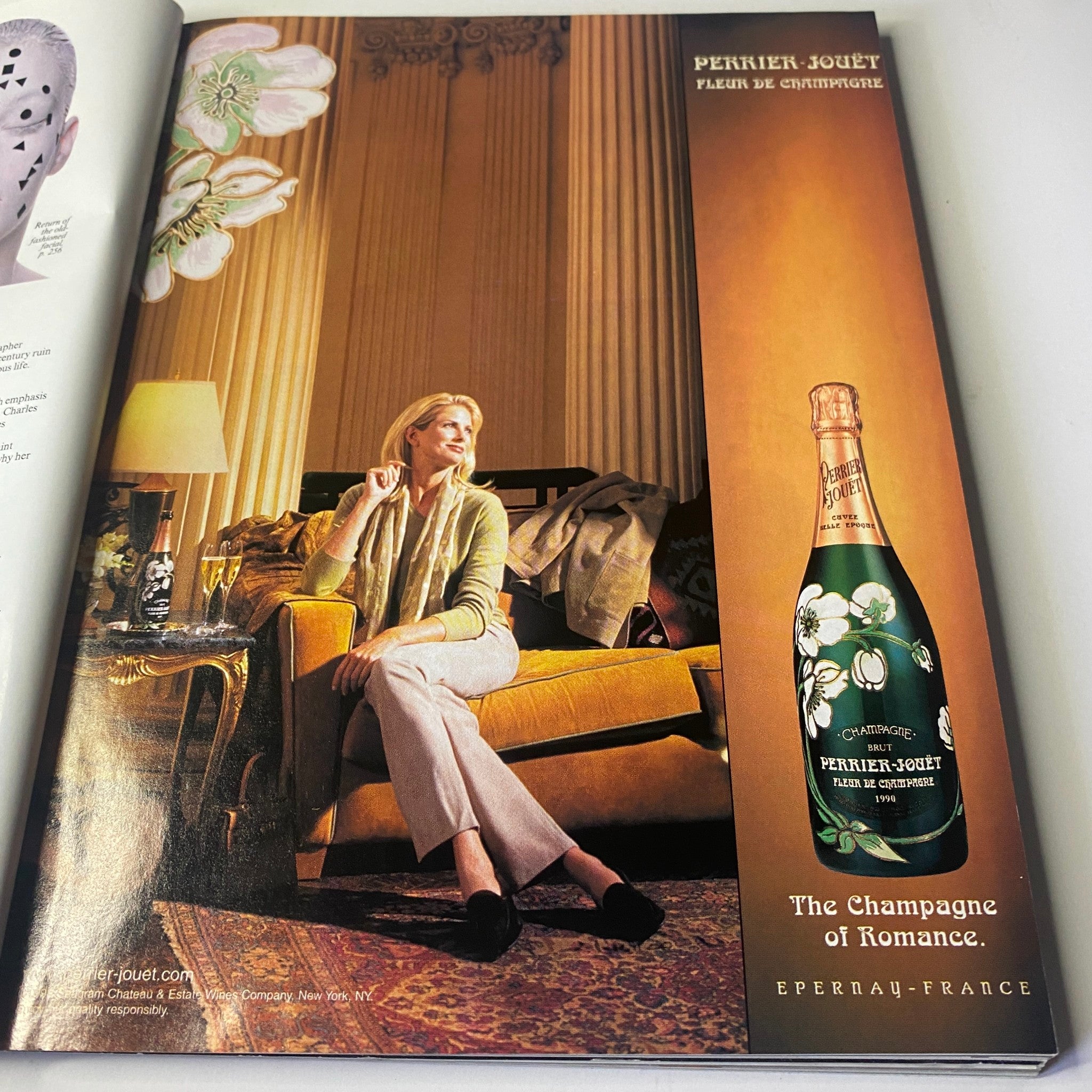 Vogue Magazine February 1999 ad for Perrier-Jouet champagne, presenting a woman seated elegantly in a vintage setting with a lush yellow couch.