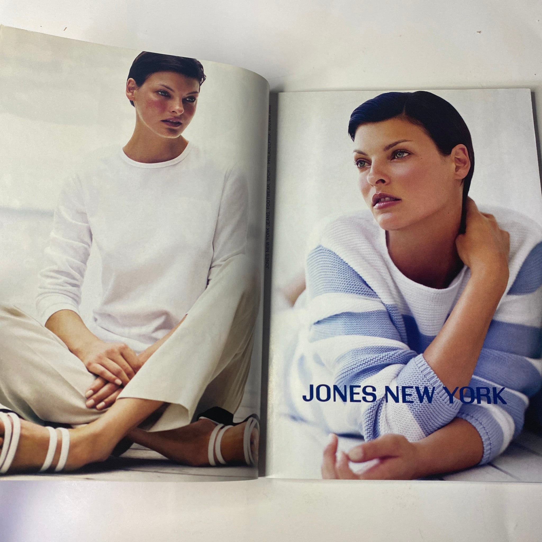 Fashion advertisement in Vogue Magazine January 1999 presenting a model in contemporary attire by Jones New York, promoting seasonal style.