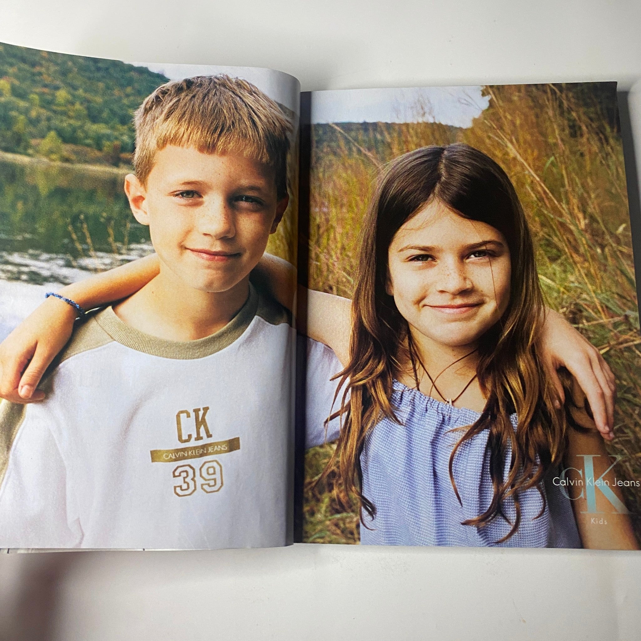 Children modeling Calvin Klein Jeans in a feature spread from Vogue Magazine April 2000, capturing the innocence and fashion appeal for young audiences.