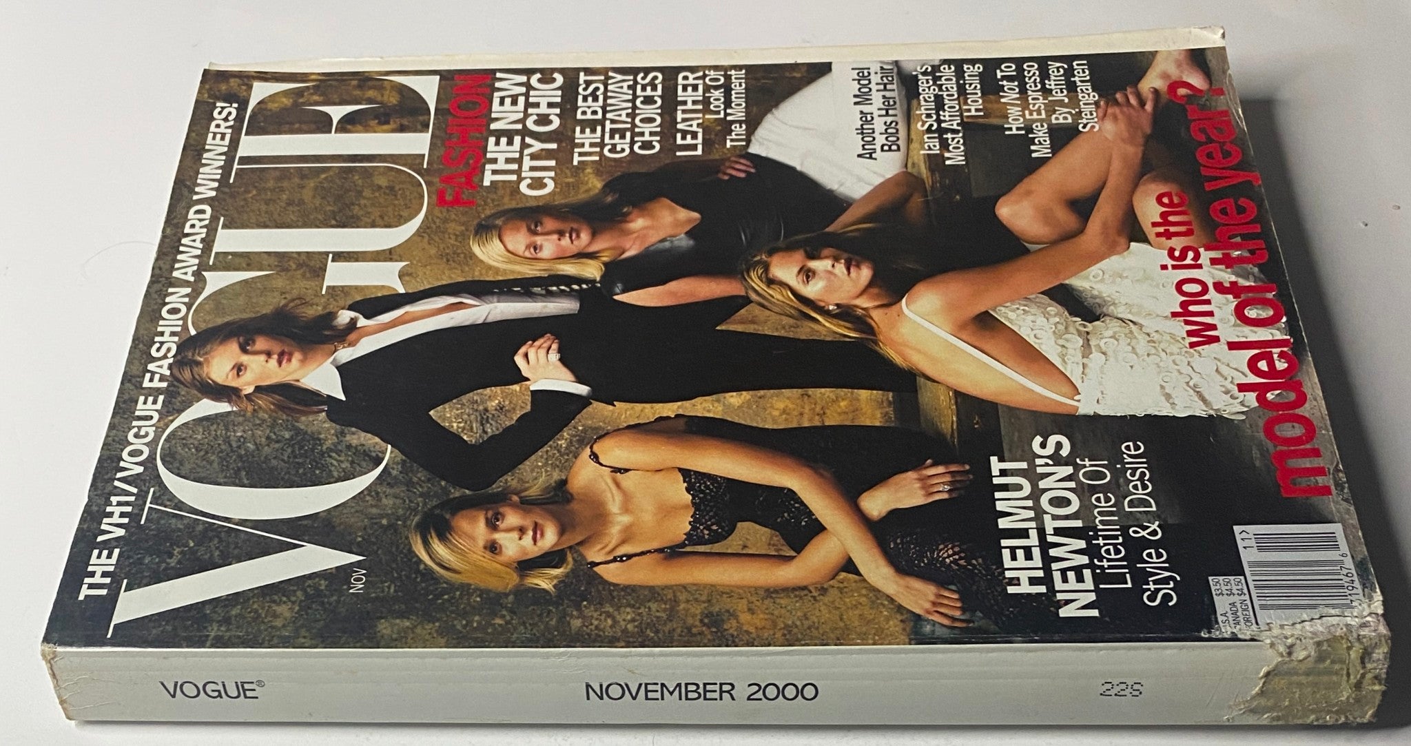 Side view of Vogue Magazine November 2000 showcasing a worn cover with models Carmen Kass, Angela Lindvall, Frankie Rayder, and Maggie Rizer, focused on fashion insights and VH1/Vogue Fashion Awards. Good condition despite minor edge wear.