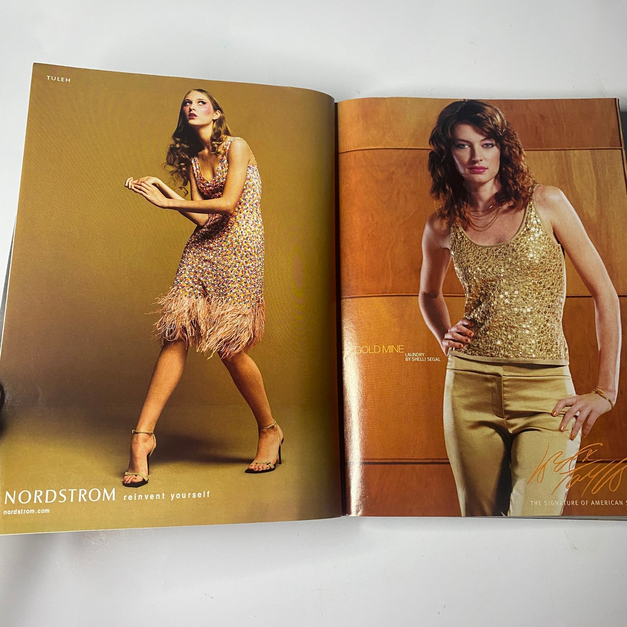 Vogue Magazine November 2000 showcasing a Nordstrom advertisement with models in glamorous outfits, emphasizing trends in high fashion.