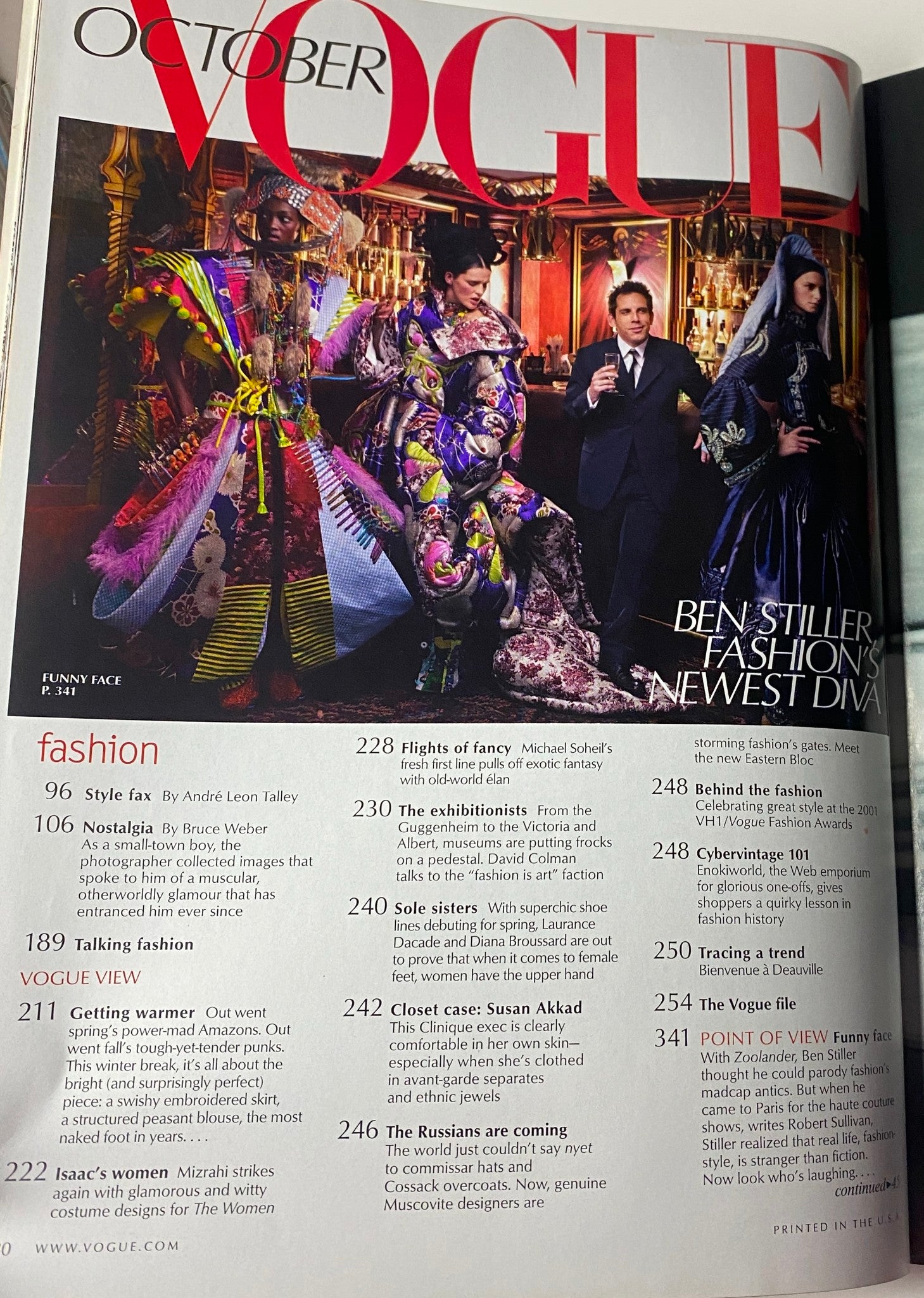 Vogue Magazine October 2001 featuring a fashion spread with vibrant attire and bold designs, showcasing the adventurous spirit of early 2000s fashion.
