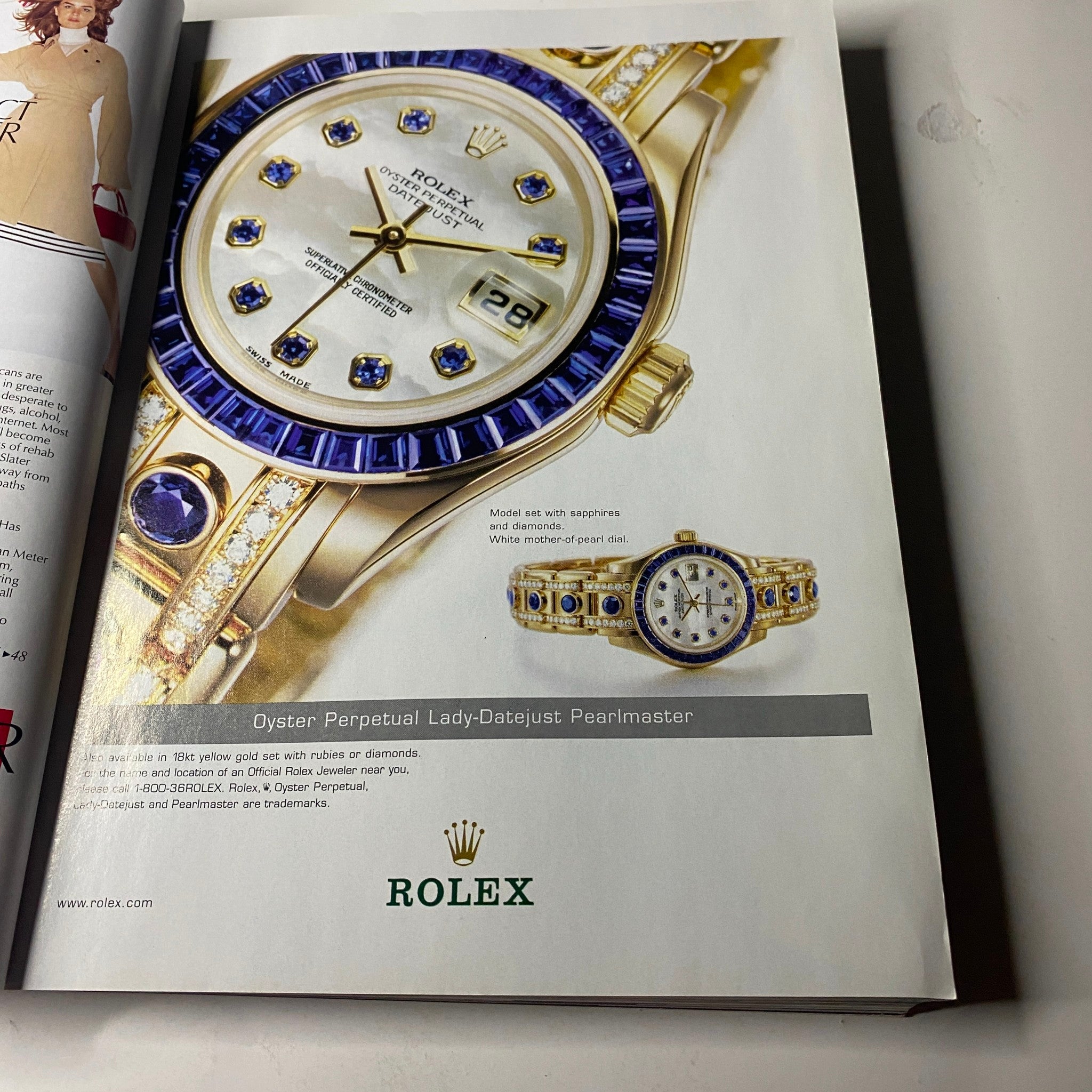 Advertisement page from Vogue Magazine November 2001 showcasing a Rolex watch, featuring in the collectible issue 'Vogue Magazine November 2001 Britney Spears Cover No Label VG'.
