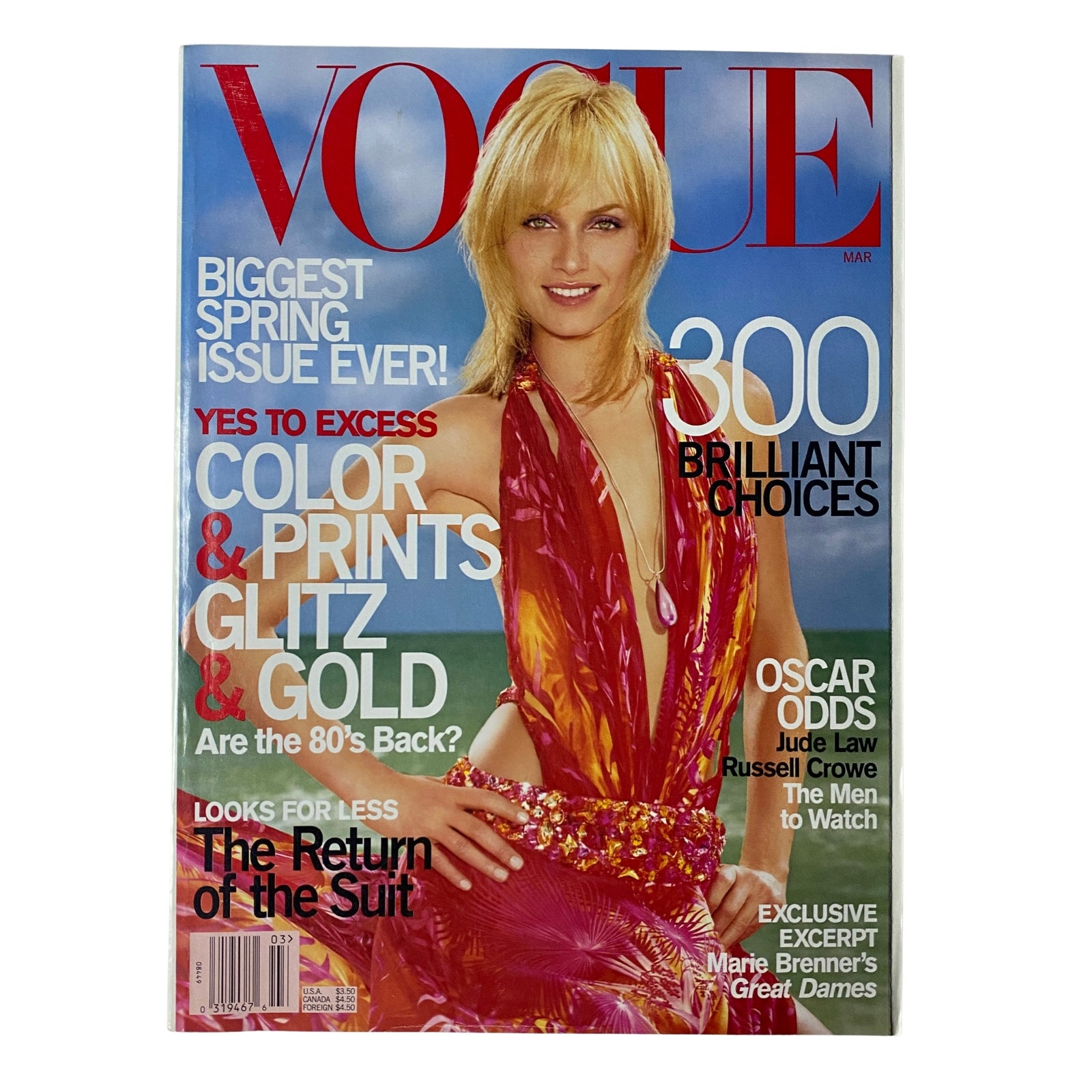 Cover of Vogue Magazine March 2000 featuring Amber Valletta, titled 'Yes to Excess: Color & Prints & Glitz & Gold.' This issue highlights fashion trends and cultural insights at the turn of the millennium.