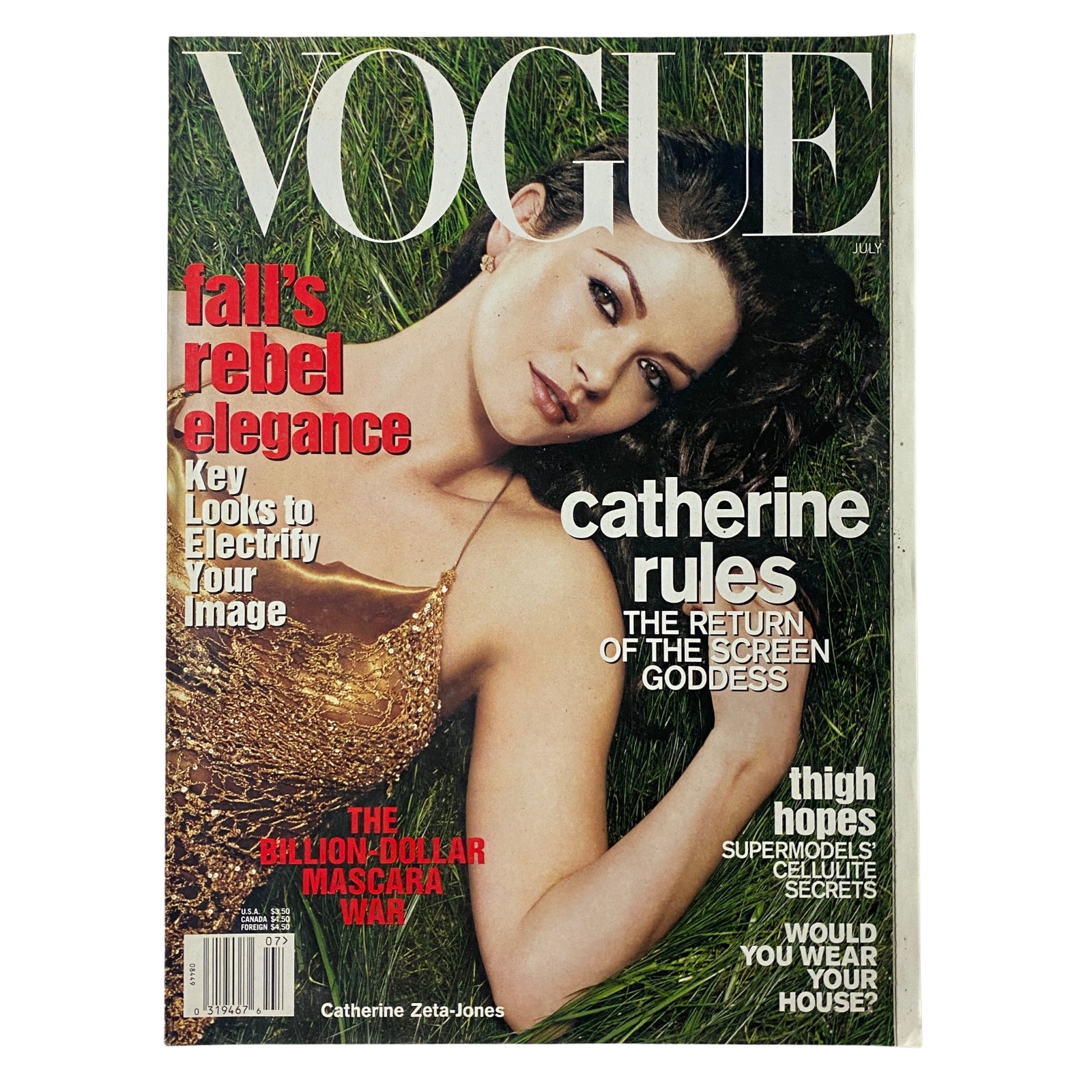 Vogue Magazine July 2001 featuring Catherine Zeta-Jones on the cover in an antique gold slip dress by Donna Karan, celebrating Hollywood glamour in very good condition.