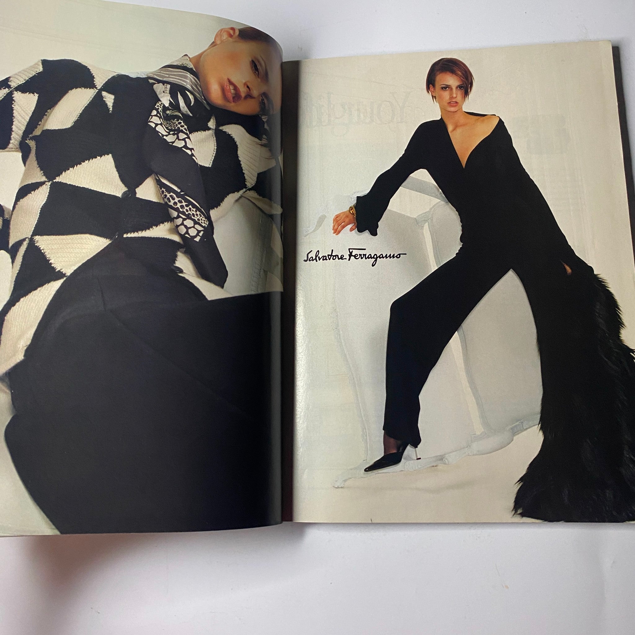 Vogue Magazine July 2001 featuring a fashion spread by Salvatore Ferragamo showcasing stunning black and white fashion pieces on a minimally styled editorial page.