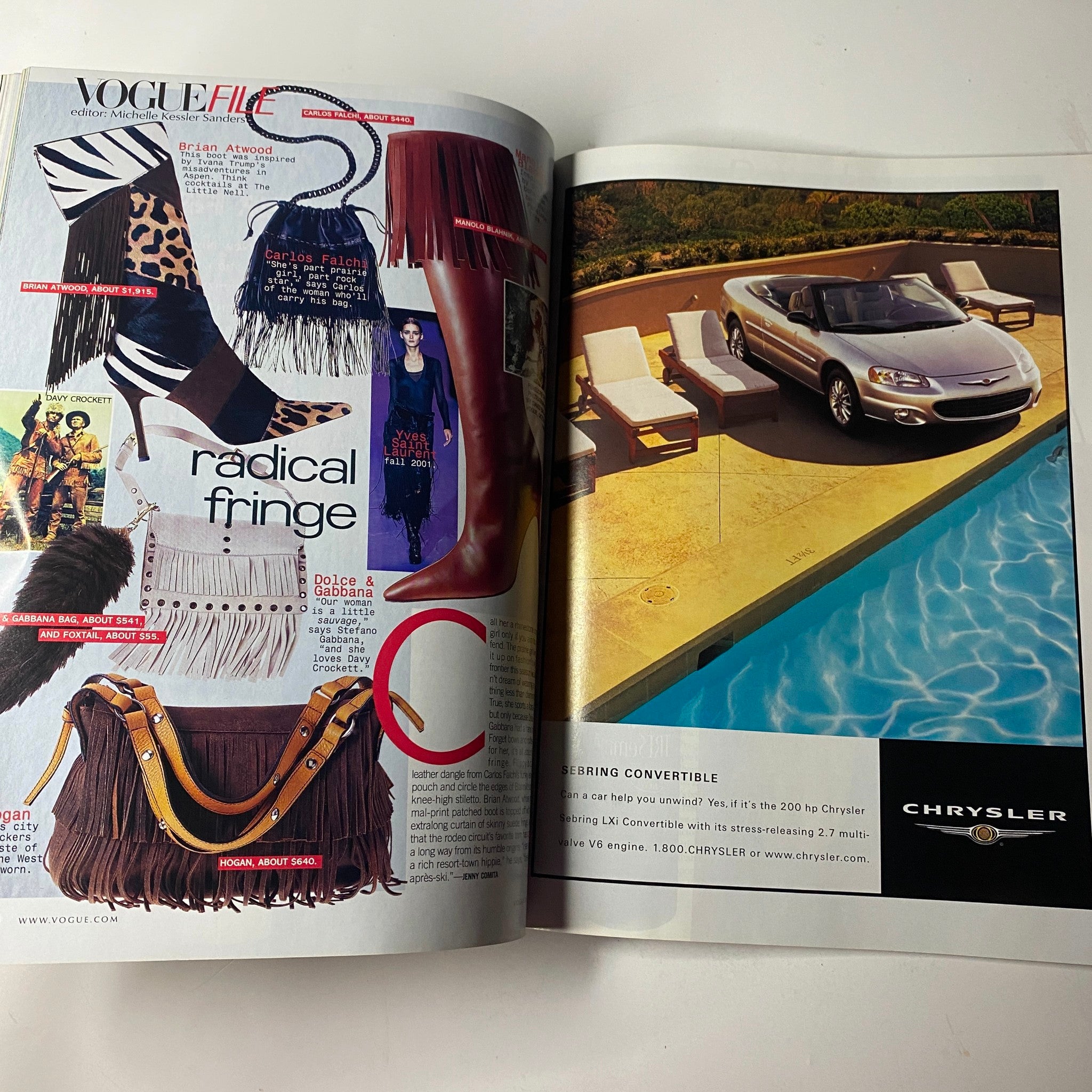 Vogue Magazine July 2001 featuring Catherine Zeta-Jones on the cover, showcasing fashion items including boots and fringe accessories, with a stylish poolside advertisement from Chrysler.