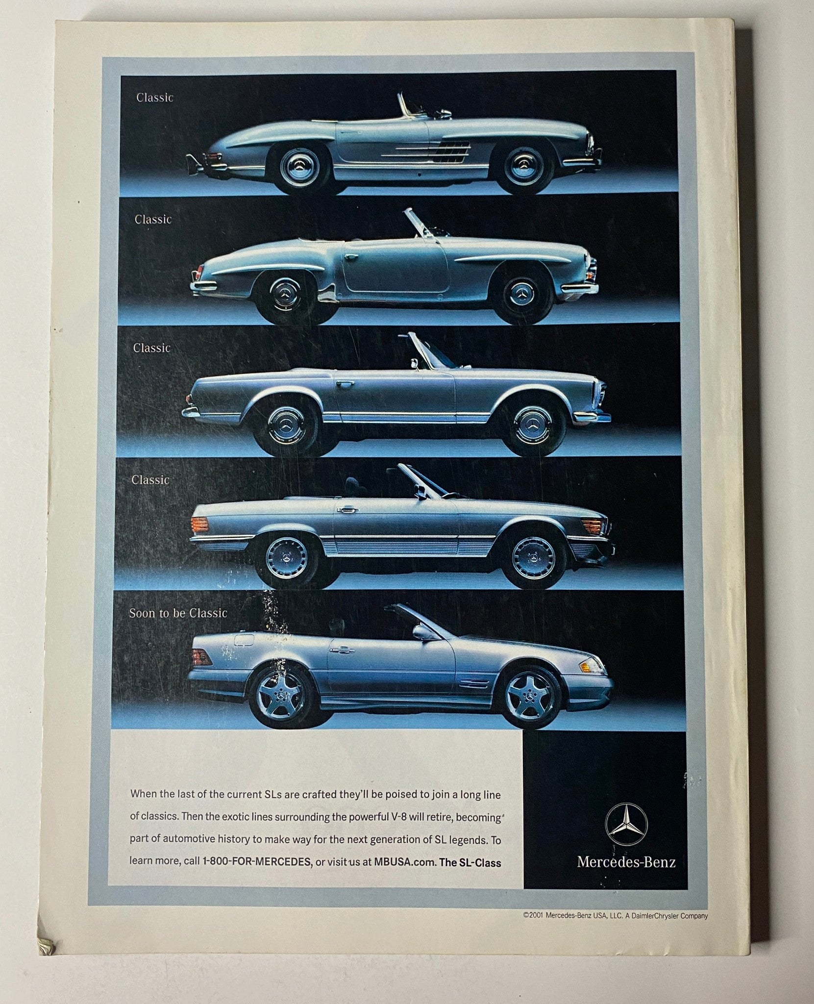 Vogue Magazine July 2001 featuring Catherine Zeta-Jones cover, with an advertisement for Mercedes-Benz showcasing a collection of classic car models.