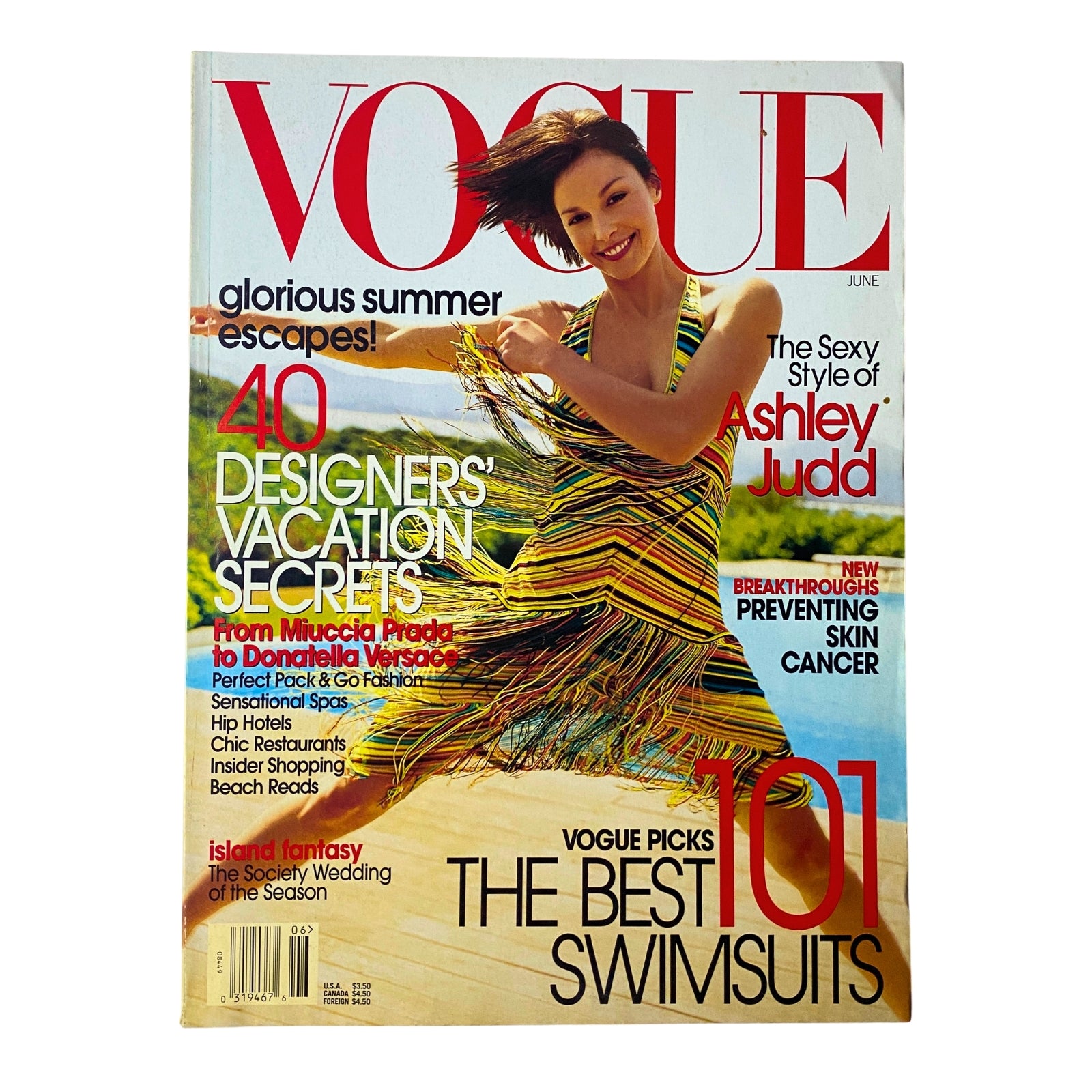 Vogue Magazine June 2002 featuring Ashley Judd on the cover, showcasing a colorful striped Missoni dress against a beach backdrop, emphasizing fashion and summer vacation themes.