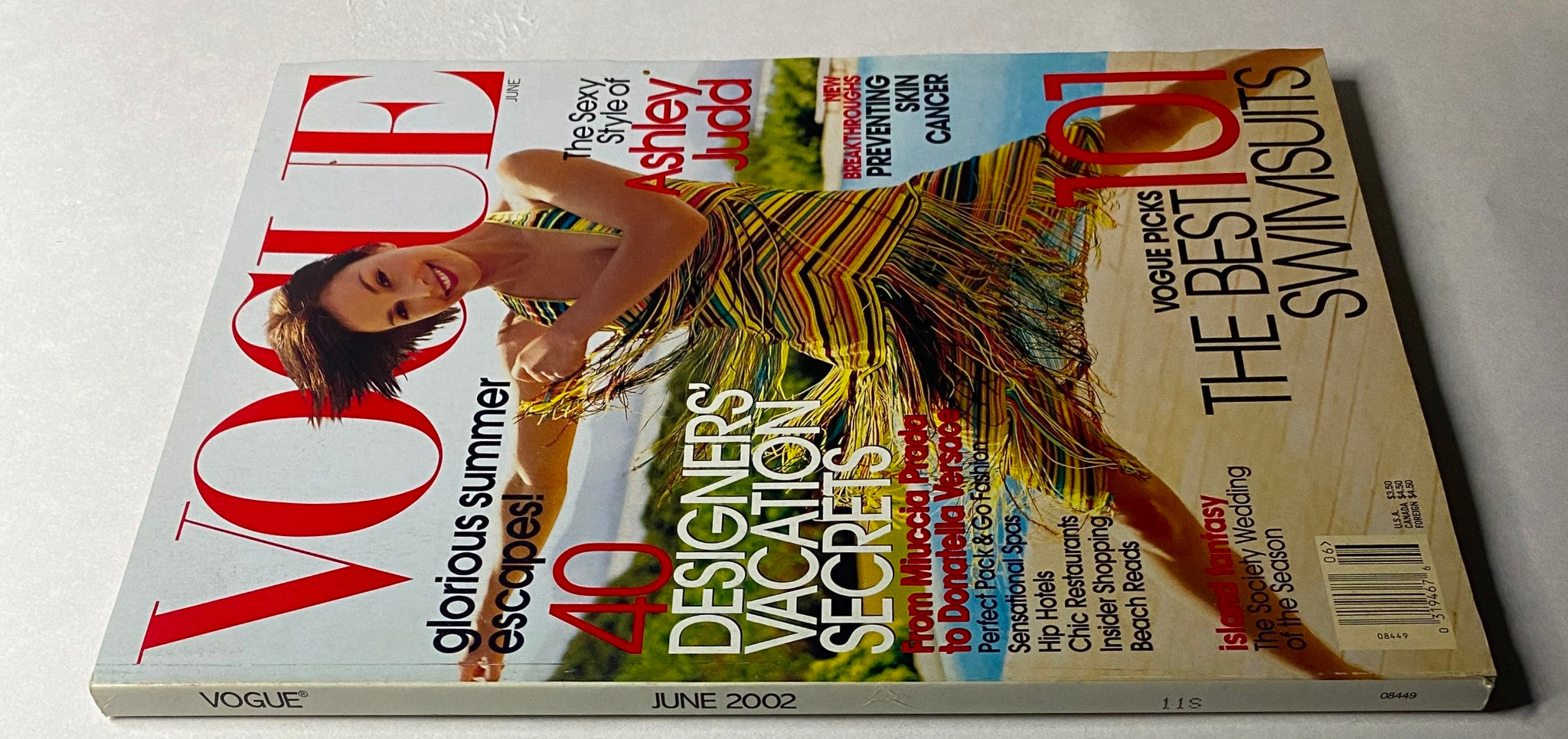 Another view of Vogue Magazine June 2002 with Ashley Judd on the cover, highlighting her stylish striped dress and summer fashion content.