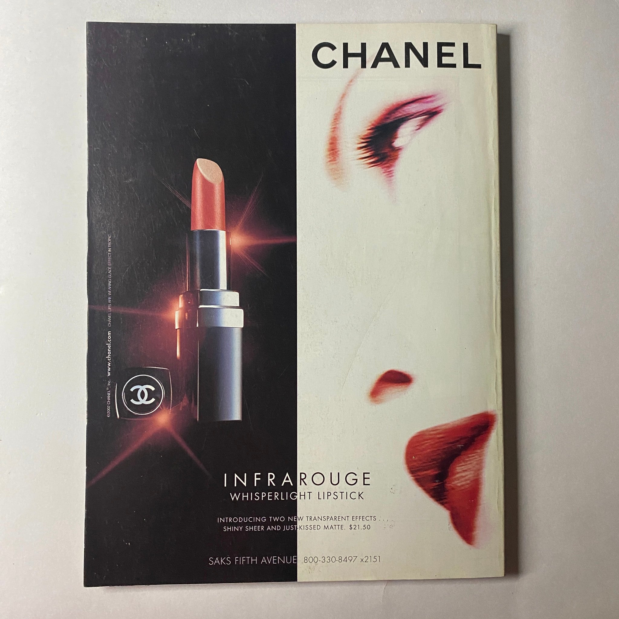 Vogue Magazine June 2002 Chanel advertisement for Infrarouge Whisperlight Lipstick, featuring bold beauty concepts with striking visuals.