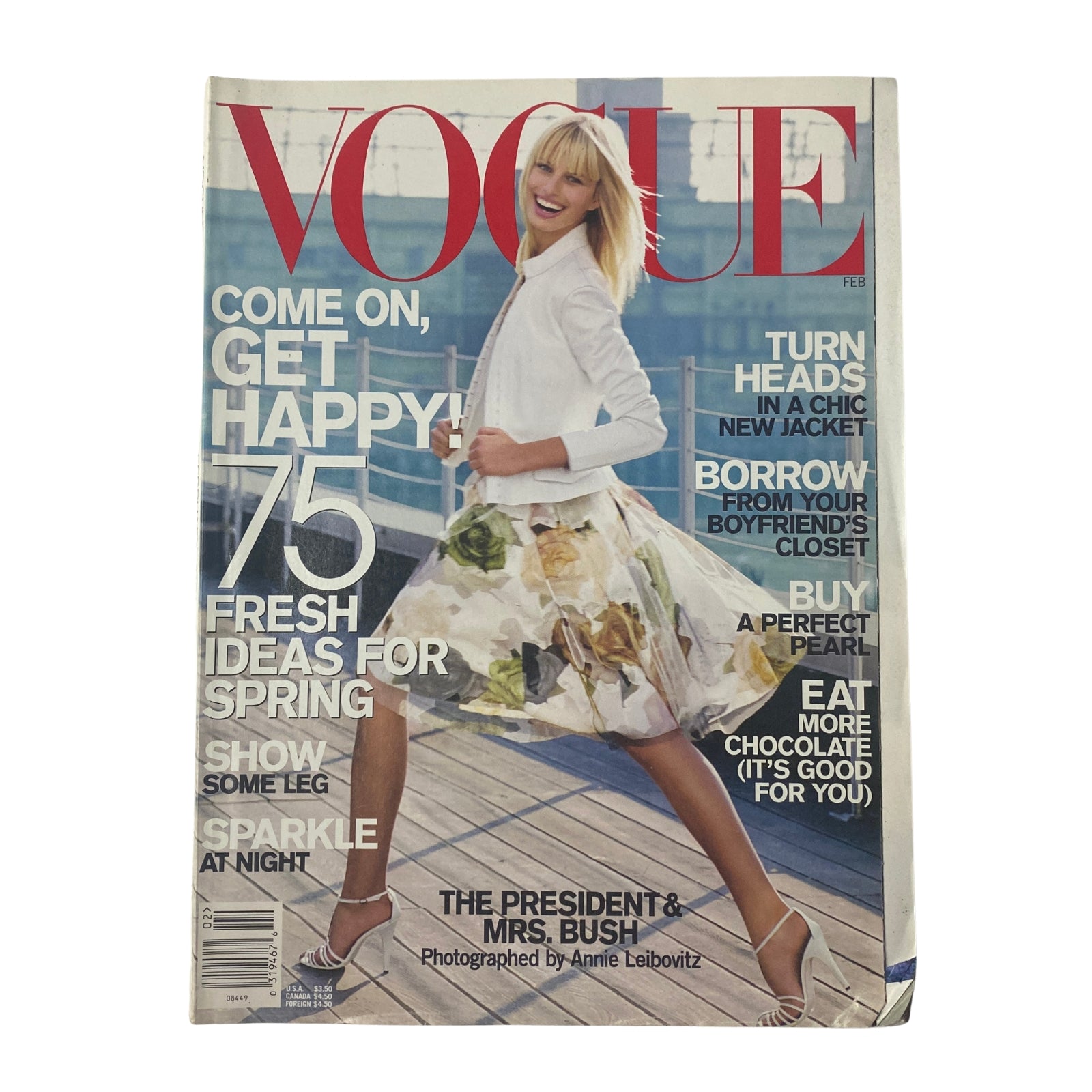 Vogue Magazine February 2001 featuring Karolina Kurkova on the cover, styled in a vibrant outfit with a floral skirt, promoting fresh fashion ideas for spring.