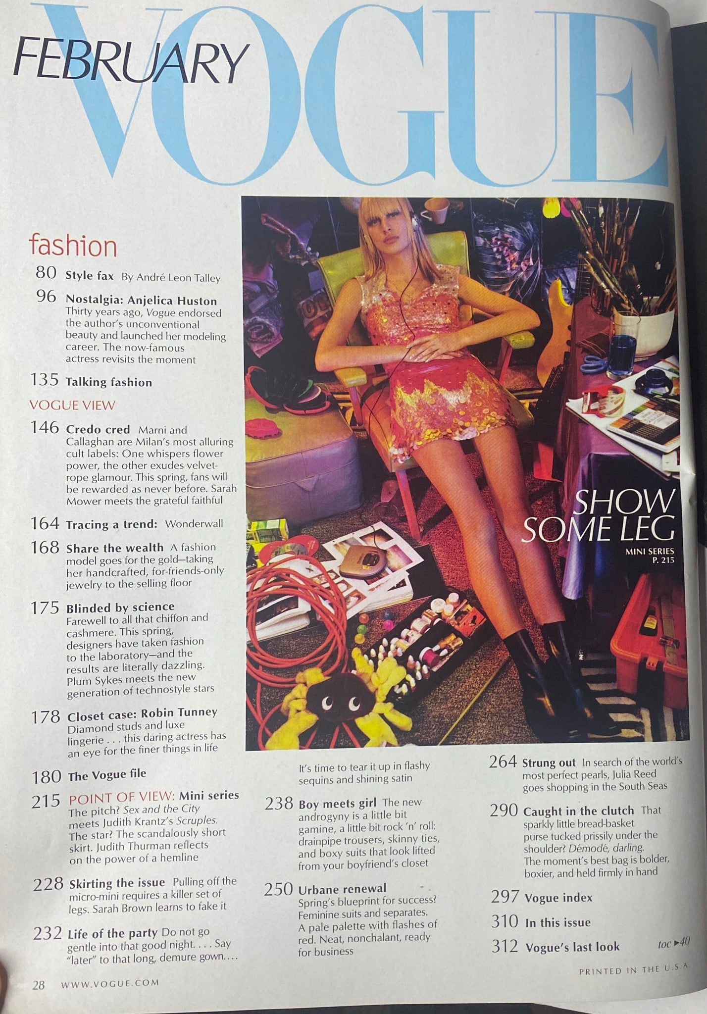 Inside page of Vogue Magazine February 2001 highlighting fashion articles, including topics like mini skirts and style tips, with a striking image of a model showcasing contemporary fashion trends.