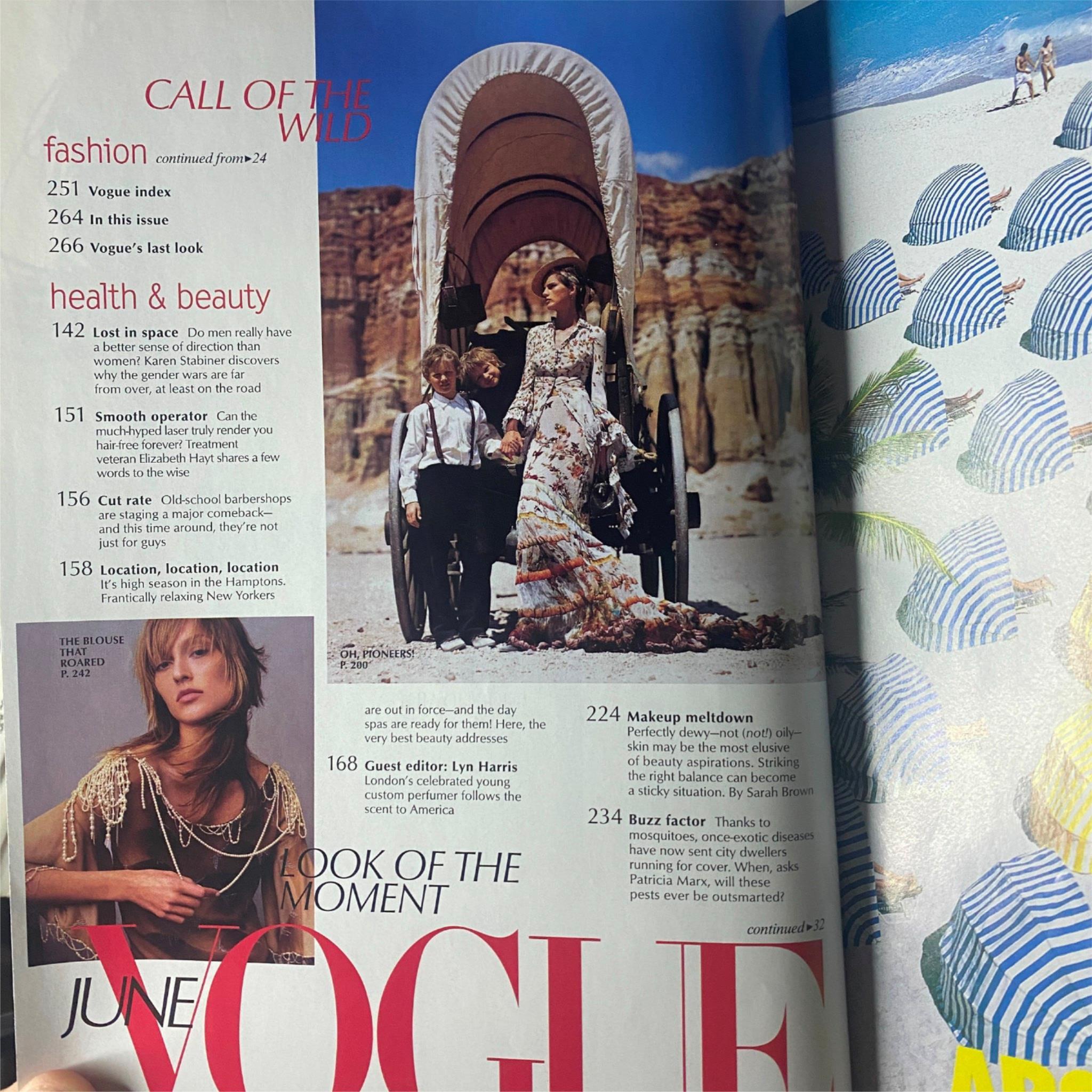 Continuation of the fashion section in Vogue Magazine June 2001, depicting a romantic bridal scene against a desert backdrop, emphasizing elegant attire.